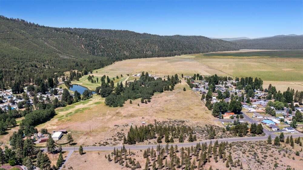 Located just 15 minutes from downtown Klamath Falls, the Round Lake region of Klamath is both quiet and serene, yet just a short drive to Sky Lakes, Oregon Tech and Kingsley Field. This property is flat with a gentle slope down to the North West corner, great for building and ease of sewer. Additionally, this property is eligible for zoning changes with smaller lot sizes, such as R1 or Residential Community, with potential for conditional use of Mobile home, RV, or Tiny Home parks (no system development fees for water or sewer). This beautiful property would also make an amazing homesite for your dream home on 20+ acres. Owner will carry with 50% down! Buyer to verify all zoning & development potential with the county.