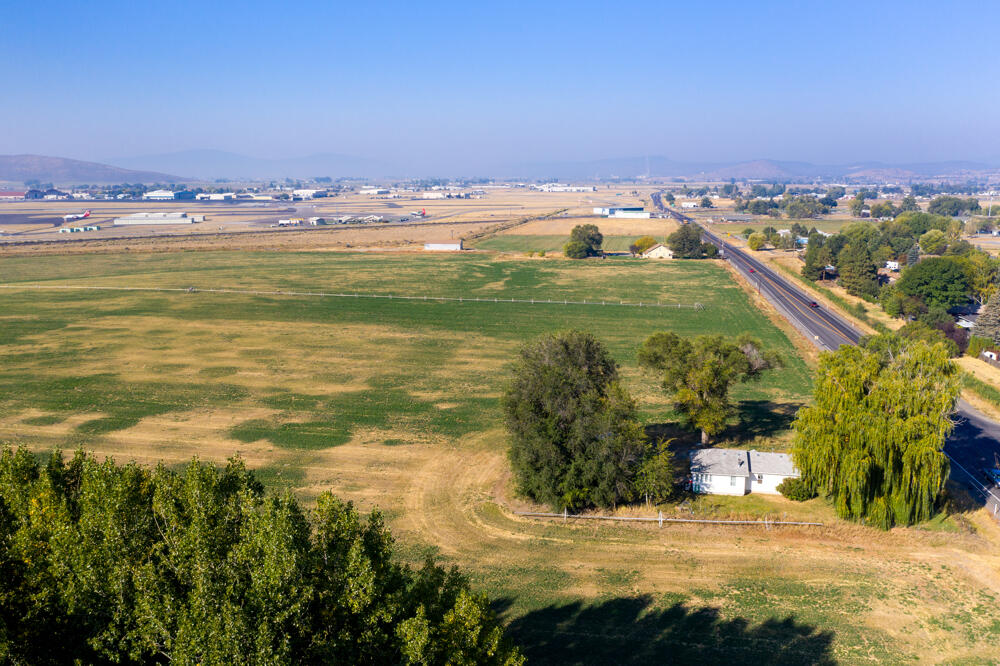 75.26 Acres Zoned Light Industrial. Access is now provided by road running East to West Coming Off Brett Way to Air Way Drive. Property has buried utilities, along with City water and City sewer. Geothermal Well tested at 1048 feet. Temp at 102 degrees.
Seller to provide Clear Phase 1
See Documents: For Maps, Geothermal Well Log. 
Contact Listing Agent for Phase One
Tenants are Month to Month. RSIS is officially  approved in the eyes of the state.