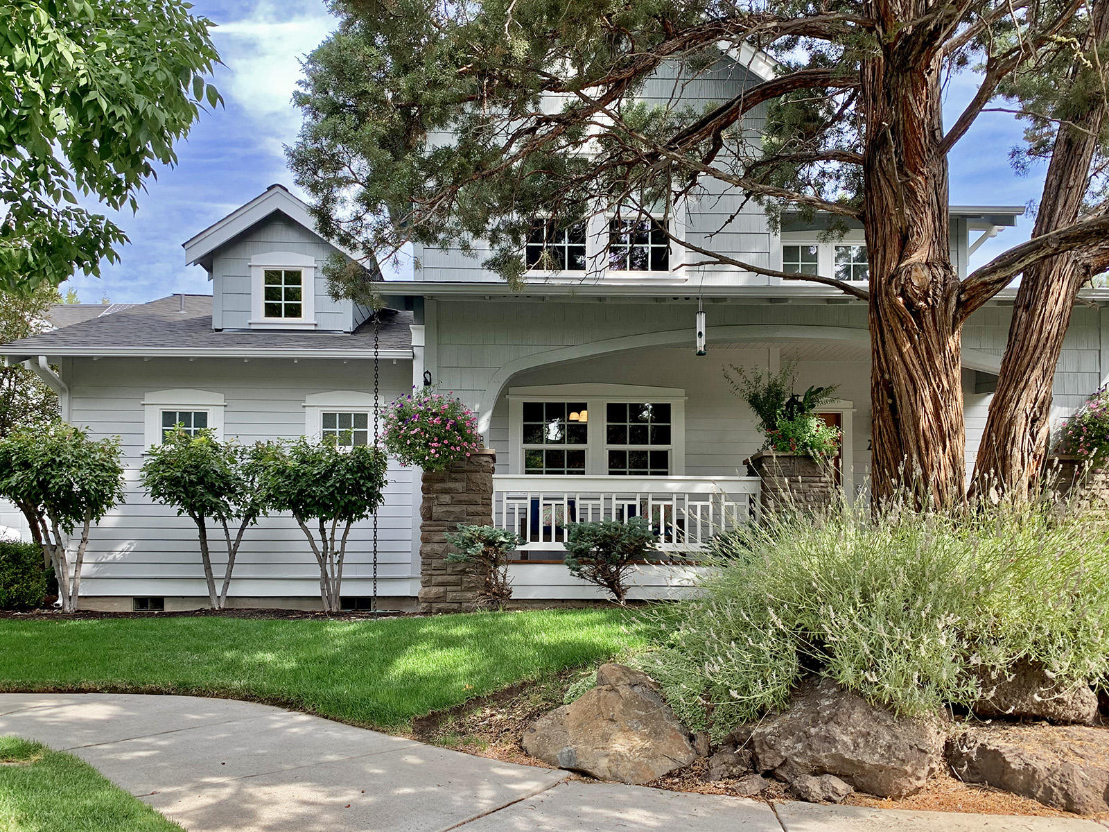 Located on one of the most beautiful streets in all of Northwest Crossing, you'll love this home's classic character & welcoming covered front porch. There's nothing cookie cutter about this one! On top of a desirable front-load garage & extra parking, upgrades abound: solid cherry wood doors; solar electric & hot water; 3-zone heating & cooling; smart sprinkler controller & surround sound throughout. Floor plan offers separation of space w/ main-floor owner suite, 3 BR + full bath + bonus space up front stairs and huge bonus room w/ craft closets & vaulted ceiling up rear stairwell. The chef's kitchen boasts built-in Jenn-Air stainless appliances, custom cherry ceiling-height cabinets & under cabinet lighting plus an awesome custom cherry wood bar w/ copper countertop & 2-tap kegerator! Northwest Crossing is a planned community that offers restaurants, shops, parks & schools all within walking distance. And no HOAs! With fresh interior & exterior paint, this beauty is move-in ready.