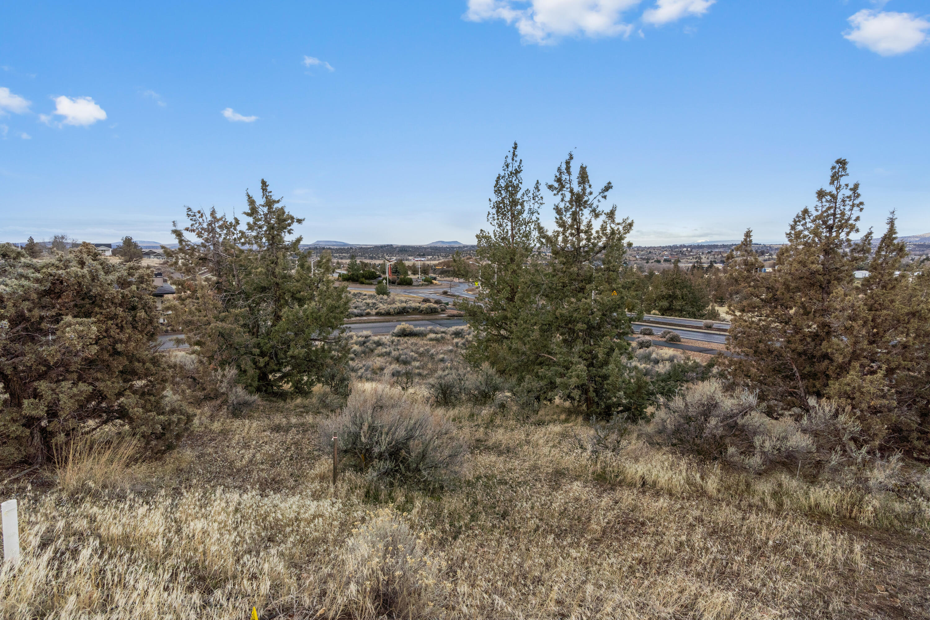 This .18-acre lot offers unparalleled panoramic views stretching for miles. Nestled in the desirable Yarrow community, you'll enjoy a beautifully maintained neighborhood park and easy access to the Madras Aquatic Center, Central Oregon Community College, local schools, and medical facilities. With its prime location and affordable price, this is the perfect opportunity to build your dream home in a scenic and welcoming neighborhood!