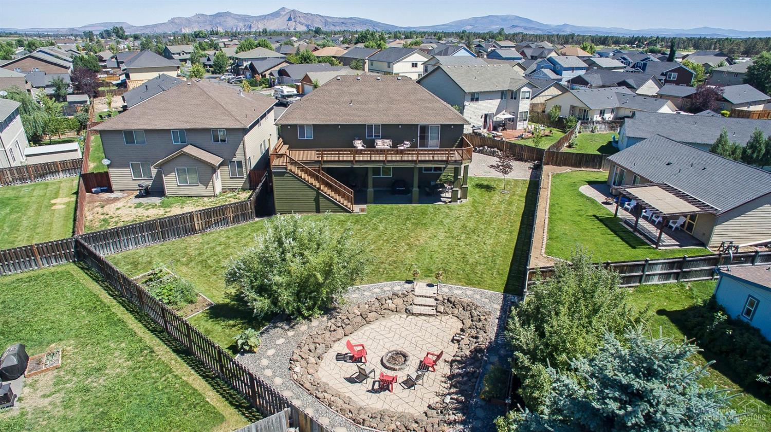 Must see to appreciate huge backyd, stone patio w/fire pit, garden area, lg. covered back patio--great for family/friends to enjoy our long summer evenings! Inside: Kitchen is a cook's delight w/slab granite cntrs, full tile b/s, generous island, Wolf range & hood, all SS appls (incl), casual dining area off Kit + separate dining room. Open floorplan great for entertaining! Amazing Master Ste upstairs w/ gas f/p, sitting/workout area & adjoining Trex deck! Bonus Rm could be 5th Bed. Much more, come see!