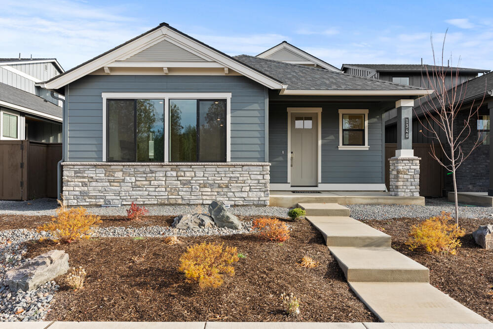 MOVE IN READY, the Aspen Townhome on Lot 70 in Collier, a premier community by award-winning Pahlisch Homes. This stunning townhome, inspired by the popular Everett model, is only attached at the garage for added privacy. Step inside to a welcoming foyer leading to an open living space. The main floor features a serene primary bedroom retreat, open concept great room and a chef's delight kitchen including JennAir appliances with a large walk-in pantry. Upstairs, enjoy a spacious loft perfect for a second living area or home office, two bedrooms and a bath. Surrounded by Ponderosa Pines in NW Bend, Collier offers easy access to shopping, dining, and miles of trails, with Shevlin Park just minutes away and a trail leading directly into Discovery Park right from the community.