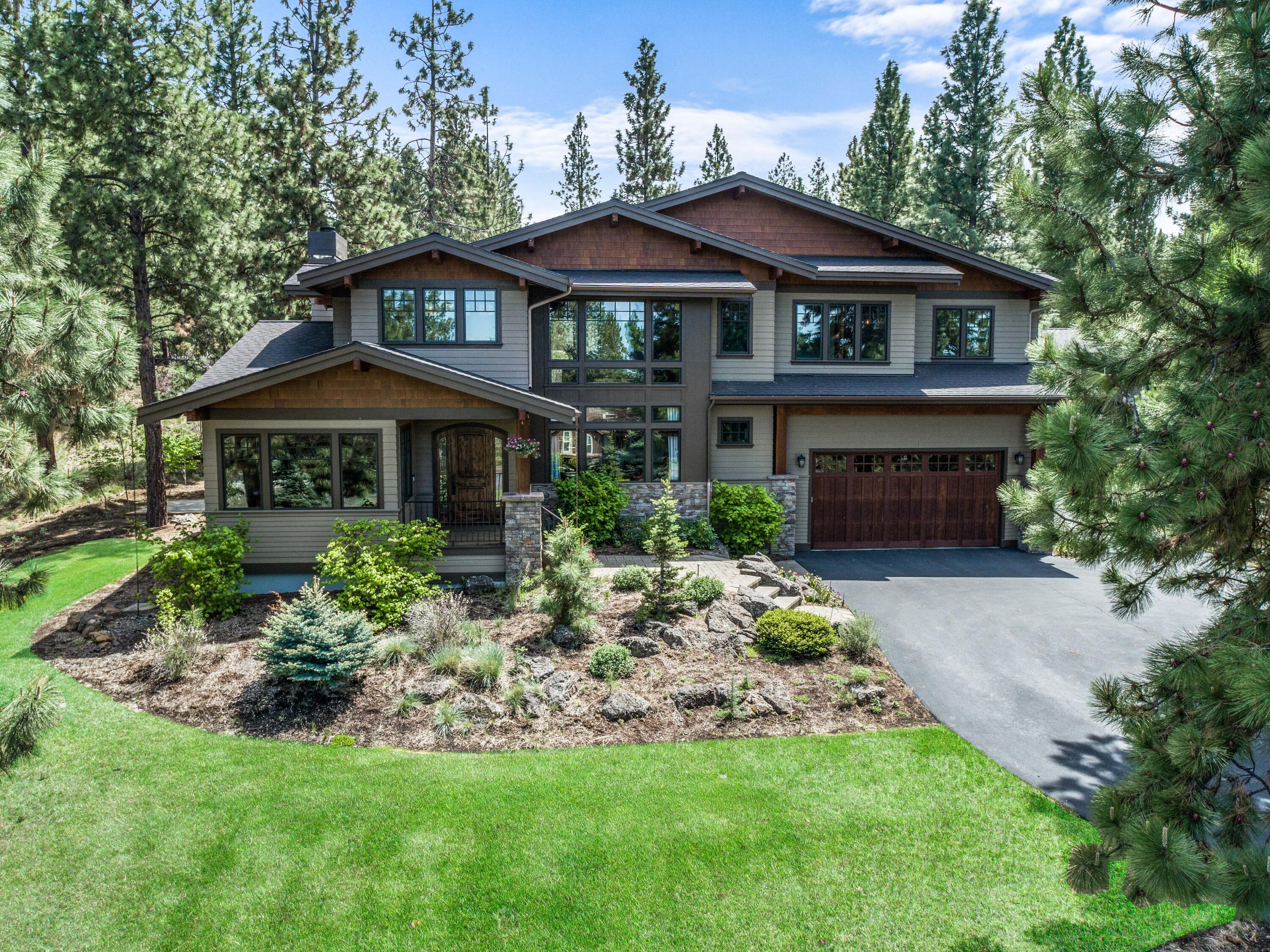This fabulous custom home in the sought-after Parks at Broken Top neighborhood is topped off by a separate shop (w/10' doors & bath) that can accommodate multiple boats, Sprinters, collector cars, etc. Home interiors provide open spaces and clean lines, characterized by an easy-flowing contemporary layout. Modern fixtures & luxury finishes adorn every room, while at the heart of the home the fully equipped gourmet kitchen is a chef's dream. Further interior highlights include living areas perfect for both relaxing & entertaining, peaceful great room overlooking incredible backyard living area; spacious office w/views of front lawn, dining room, private primary suite, 4 lovely guest rooms, pet-suite & fabulous family room large enough for ping-pong, movie nights & entertainment w/ wet-bar & outdoor balcony. Lower level comprises private space for addtl bedroom, gym or studio. Spacious terrace with firepit & hot-tub patio overlooks incredible private oasis, located at end of cul-de-sac.