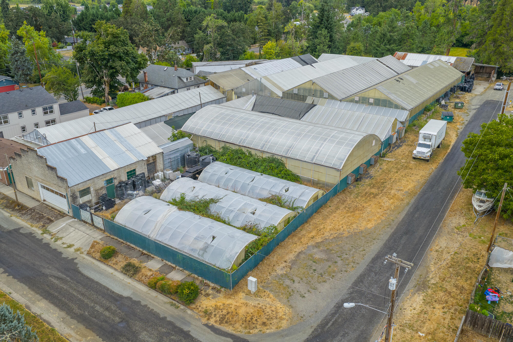 Versatile 1.6-acre live/work property in Cottage Grove with dual residential and commercial zoning. Includes a 1925 Craftsman 3BD/1.5BA home, 10 greenhouses, 3 hoop houses, barn, office, temp-controlled room & storage. 1.33 acres of 1926-priority water rights. Ideal for nursery, propagation or mixed-use business. This zoning is very flexible leaving you with a multitude of combinations for residential and commercial development. Explore the multitude of development options w/ the City of Cottage Grove.