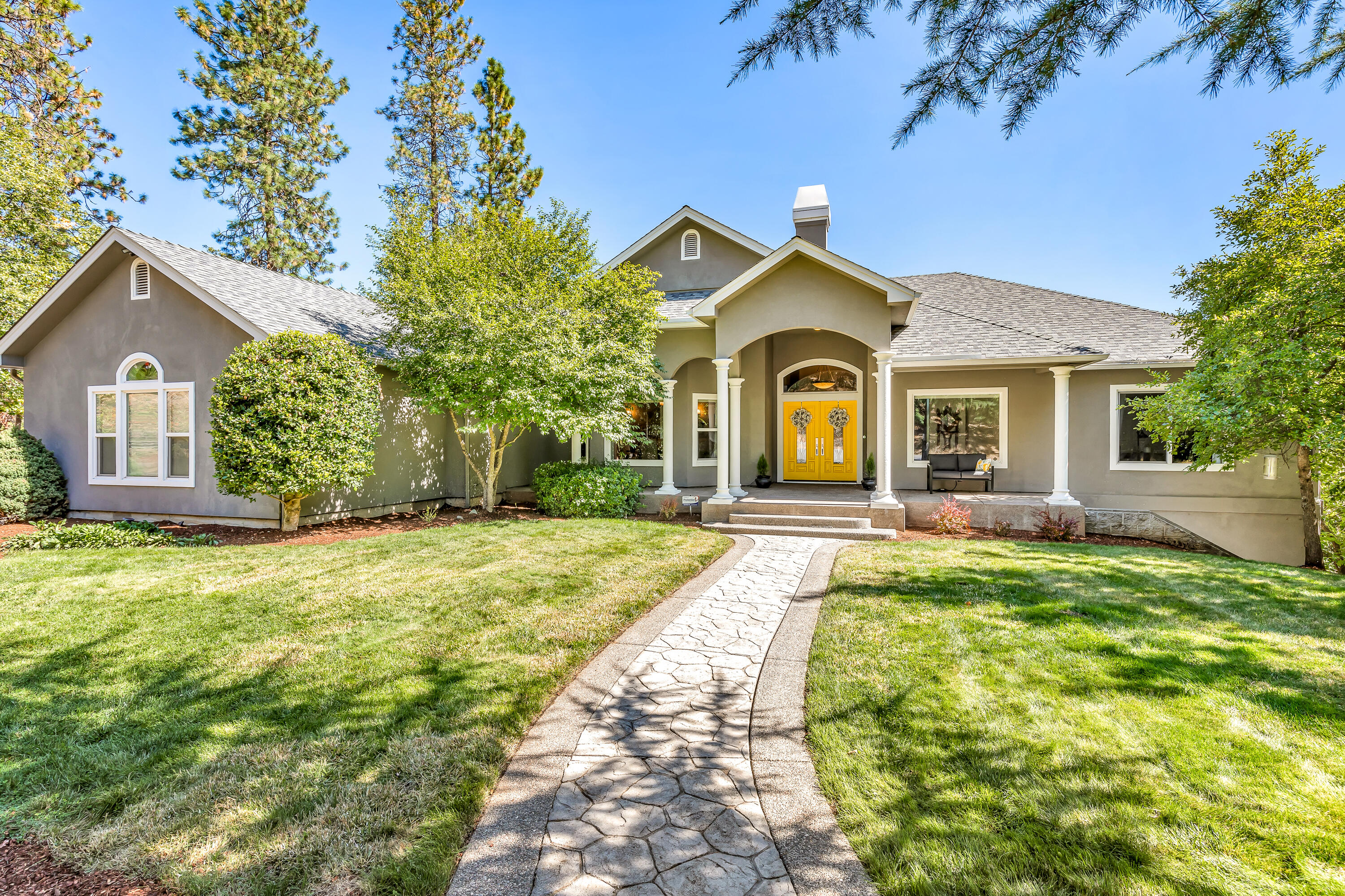 Stunning custom home w/ a brand new roof (Aug 2024) on a .93 acre lot minutes from historic Jacksonville! As you enter, the high ceilings & expansive windows bathe the home in natural light & showcase beautiful views. The spacious, open kitchen is furnished w/ granite countertops, a walk in pantry & newer appliances. The open floor plan seamlessly connects the kitchen to the living area & formal dining rm: perfect for entertaining. Step outside to 1 of the 2 expansive decks - great for enjoying the views & al fresco dining. In addition to the 3 car garage, the home boasts a remarkable 1,716 sq ft RV garage, providing ample space for a 40' RV & more! Unwind in the primary suite, which features a gas fireplace, bathroom w/ soaking tub & double walk in closets. Downstairs you will find a secondary living space w/ a wet bar, along w/ add'l guest bedroom & full bath. The home also features more amenities such as a central vacuum, integrated sound system & fully equipped gym. Come and see!