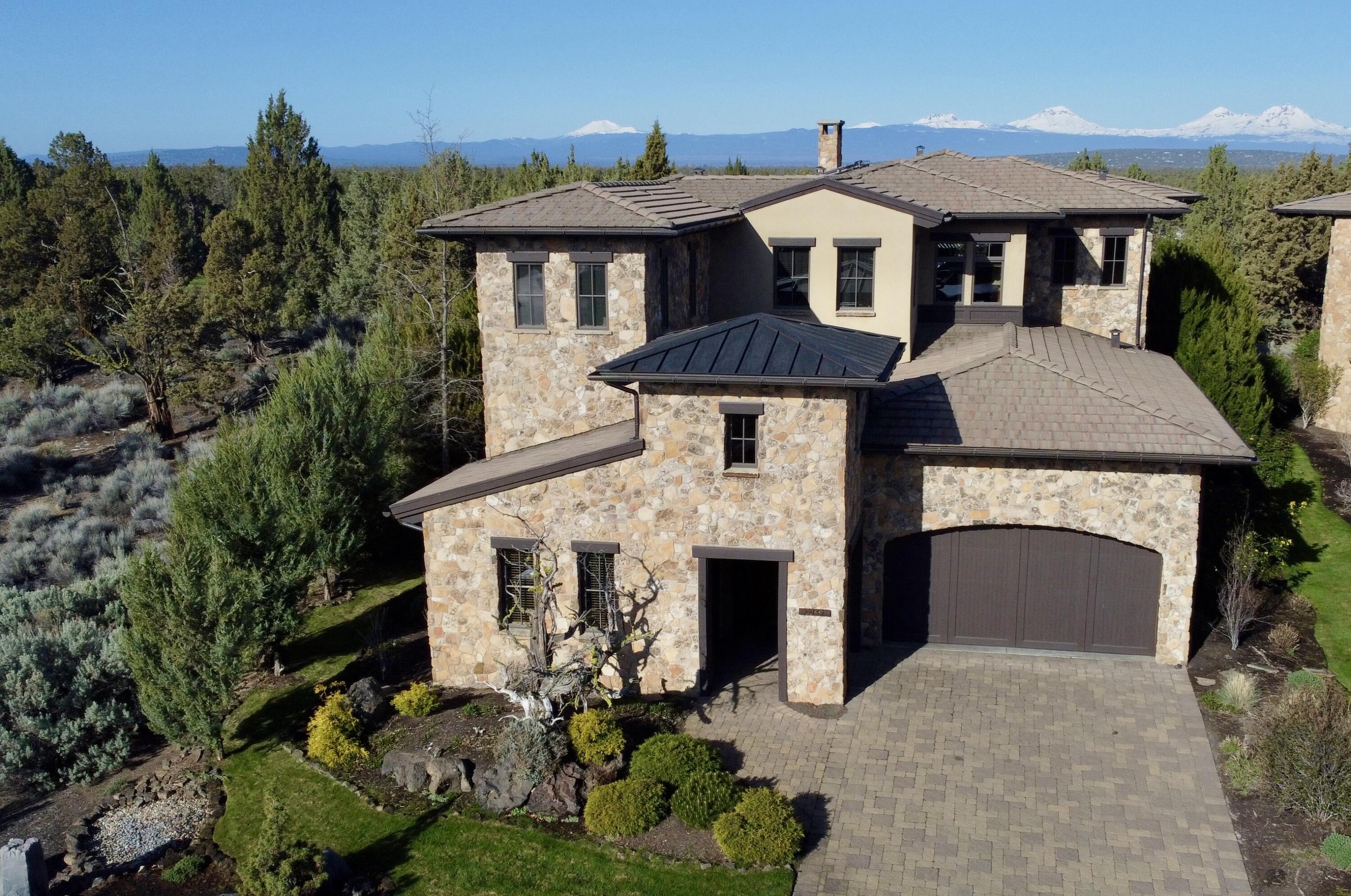 LIVE, PLAY & EARN!! The premier lot offers unparalleled privacy & breathtaking, unobstructed Cascade Mountain views over the 17th Fazio fairway. The timeless natural stone exterior features a welcoming courtyard, a see-through stone fireplace creates a warm, inviting atmosphere.  Multiple French doors open to a courtyard & covered patio with an outdoor kitchen, firepit, fireplace, and a putting green/bocce court—perfect for entertaining. The stunning primary suite boasts a fireplace, sitting area, coffee bar, spa-like bath, private balcony & expansive views. A lock-off 3rd bedroom & bonus area with a kitchenette provide additional guest comfort & privacy.  Home includes an office/4th bedroom, a spacious & climate-controlled wine cellar, an oversized 2-car garage & a separate golf cart garage. Updated lighting, paint & stylish window treatments! List price includes a Premier $115,000 Club Membership. With a strong nightly rental history, this furnished property is a rare opportunity!!!