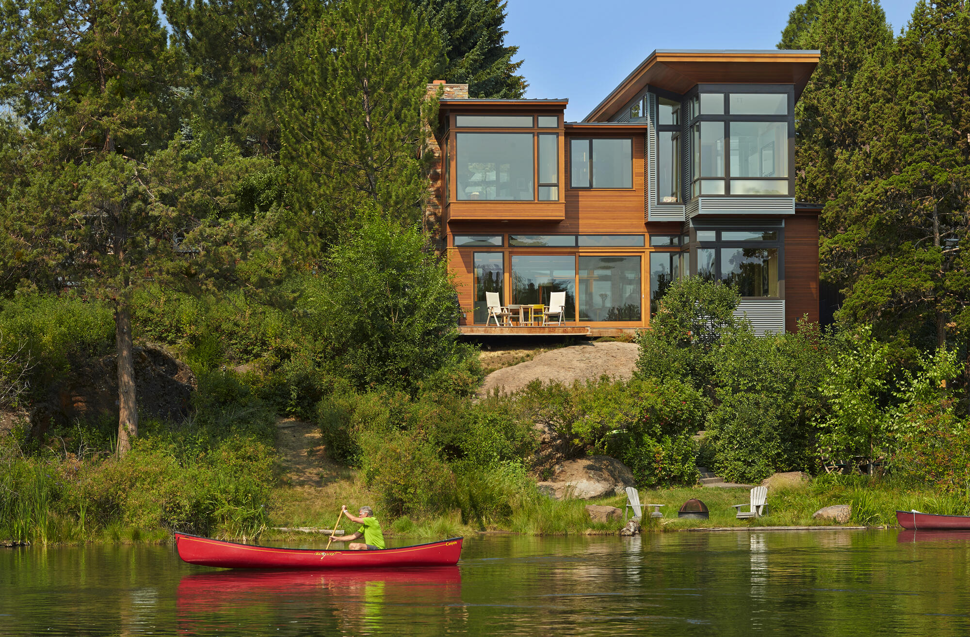 Don't miss this flawlessly designed home by FINNE Architects that
perfectly fits its iconic Deschutes River setting. The location cannot be beat- in the heart of downtown Bend, within walking distance of Bend's best restaurants, brewpubs, and shops. When you return home and step back through the pivot-hinged front door - the luxuriant natural light, stunning river views, and private tranquil spaces will immediately reconnect you with nature. The main living area is completely transparent to the river on one side and to a private courtyard on the other. Both the river and the courtyard are accessible by large 8-by 8-foot sliding glass panels. The master suite and den are cantilevered toward the river, providing unmatched bird's-eye views of the ever-changing river and its wildlife. Launch your watercraft easily from the flat lower yard. Seize this once-in-a-lifetime opportunity to own and enjoy this expertly crafted, stunning landmark property!