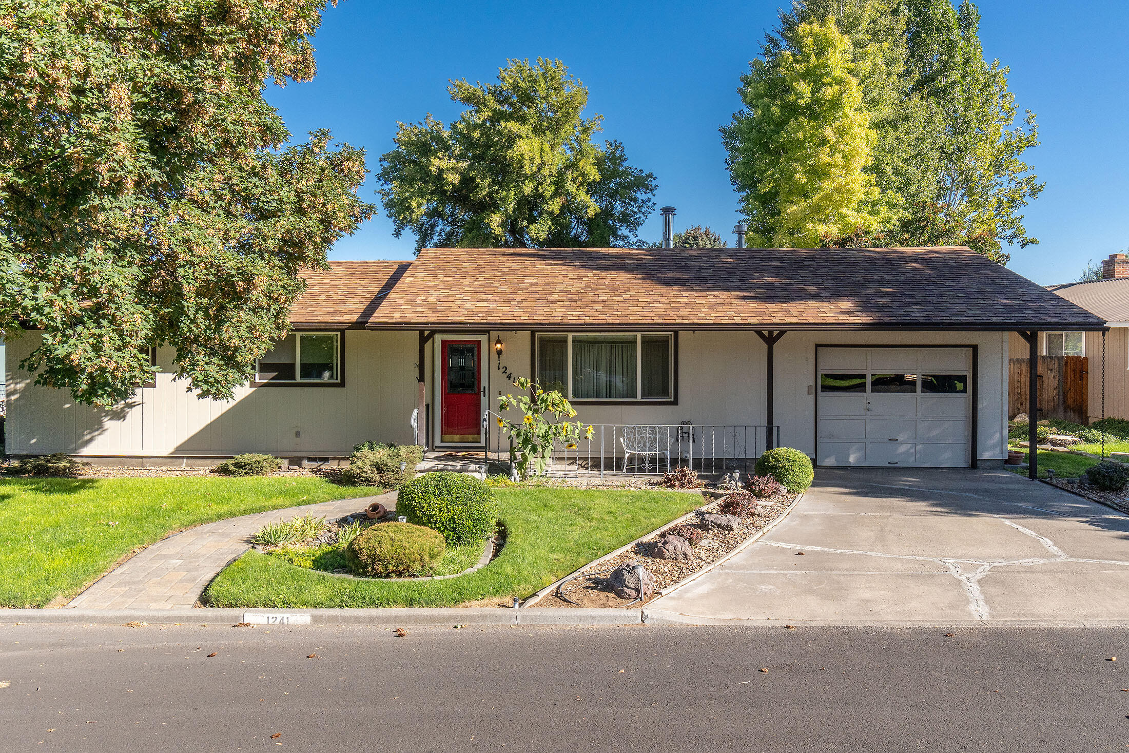 Move In Ready! Single-Level Home with Spacious Backyard & RV Parking! Welcome to this well-maintained and landscaped, 3-bedroom, 2-bath home located in Hidden Springs on Knowledge Street—just minutes from schools, shopping, & medical facilities. Quality construction w/ mostly updated flooring & Corian counters in kitchen, this home offers both comfort and convenience. Enjoy cozy evenings by the wood stove or stay perfectly climate-controlled year-round w/ a gas furnace & central AC Unit. The expansive master suite is a true retreat, featuring a lg master bath w/ beautifully tiled walk-in shower, generous walk-in closet & sky light for natural lighting. Step outside to a large fenced backyard with a garden area, covered pergola with electric awning, and storage shed. The property includes an irrigation well, city water & sewer, w/ alley access providing ample space to park your RVs or recreational toys. Most all furnishings negotiable. This home checks all the boxes—come see today!