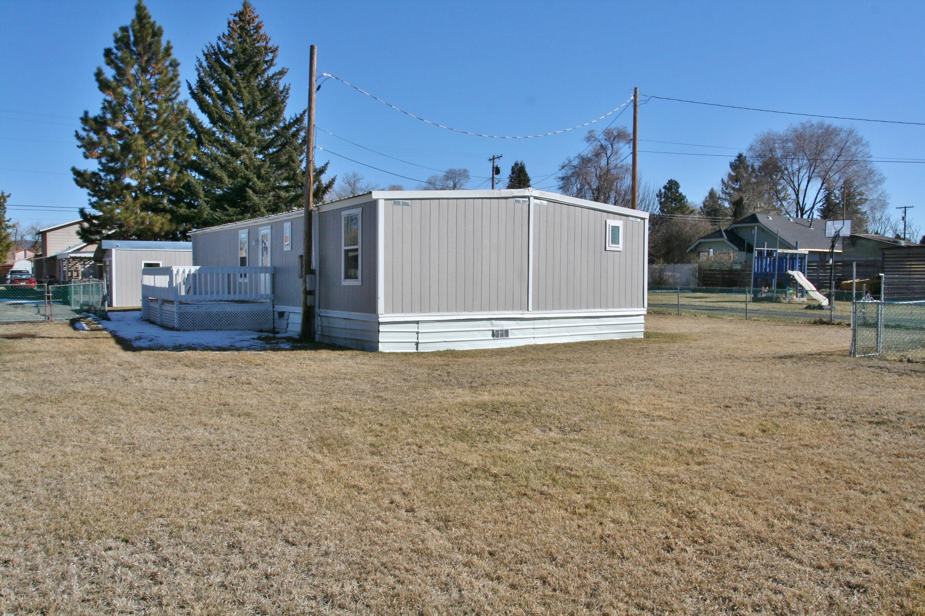 Clean and tidy in move-in ready condition with loads of attractive new paint, vinyl & carpet too. Updated interior doors, newer exterior siding, vinyl windows, F/A gas heat, new gas water heater being installed & more. Super shop area that could serve a multitude of needs or hobbies. Fully fenced yard with fenced garden area/dog kennel, RV gate to allow access for additional parking too. Easy to show and ready for new owner!