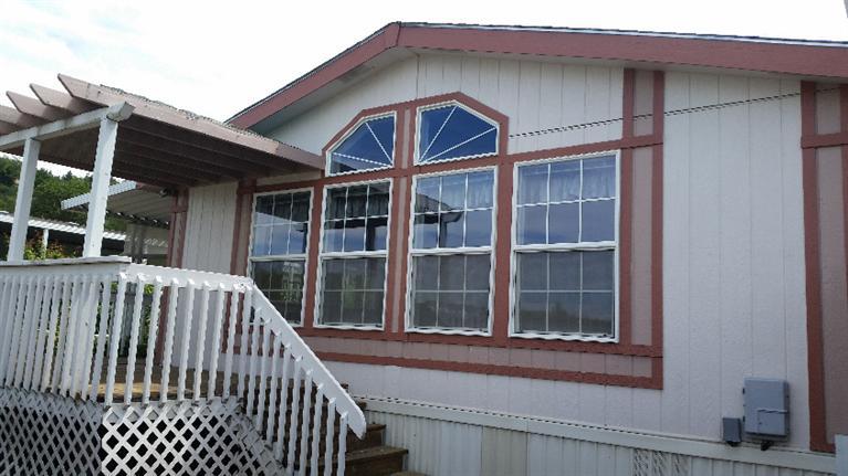 Located in the desirable Western Carriage Estates, a 55+ park, just minutes from historic Jacksonville! This lovely three bedroom, 2 bath home features vaulted ceiling, spacious kitchen with oak cabinetry, newer wall oven & microwave. Park amenities include a club house, in-ground pool, and billiards room. Large deck, covered carport, detached shed. Enjoy the country, but just minutes to Medford and Jacksonville.
