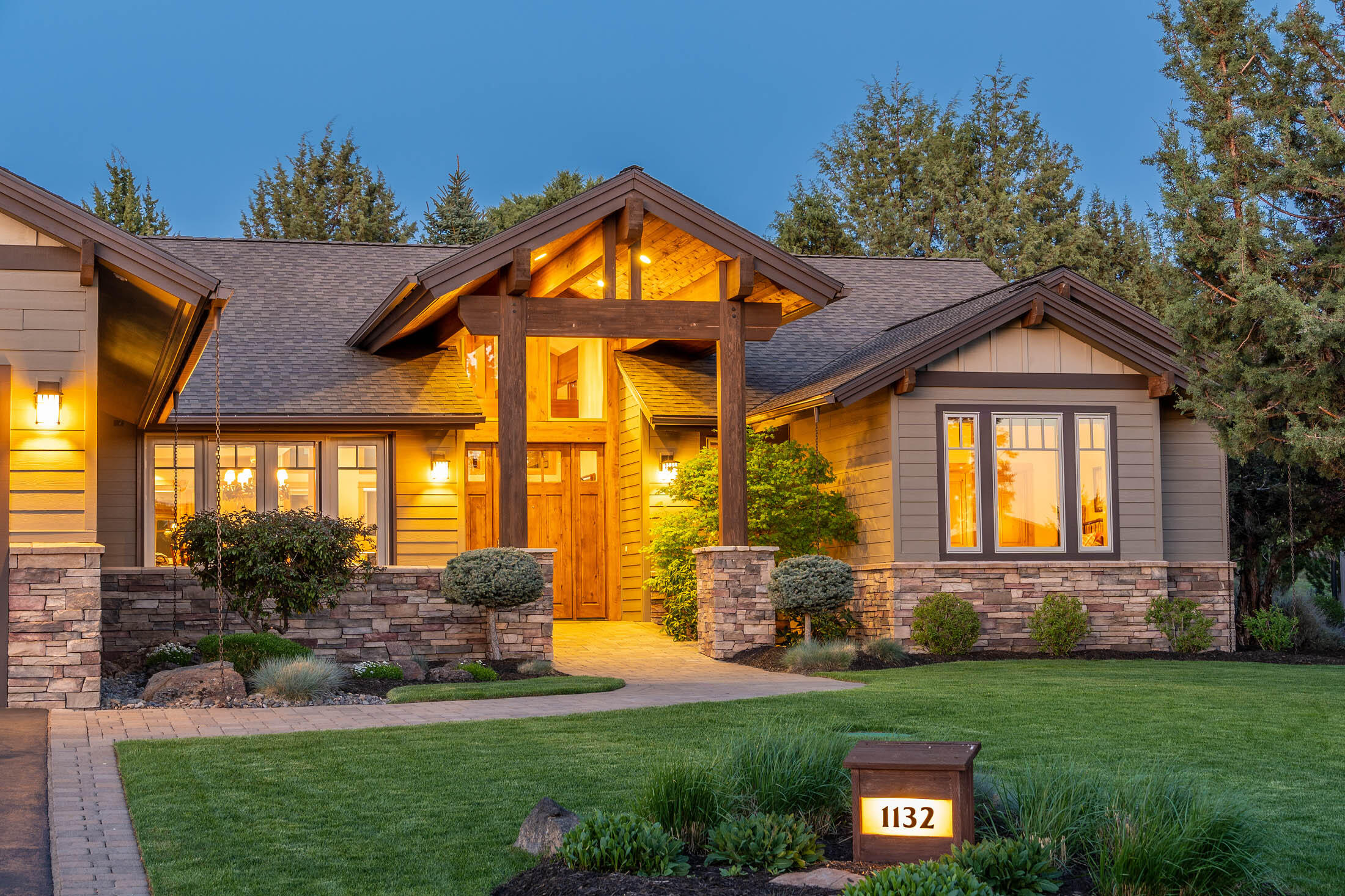 Welcome to 1132 Trail Creek Dr. in Eagle Crest, where luxury and quality craftsmanship blend effortlessly in this magnificent home built by BlackRock Construction. The soaring 14 ft vaulted ceiling adorned with exquisite timbered beams creates a striking focal point, while the 8 ft knotty alder door beckons you.  Floor to ceiling wood wrapped windows.  Beautiful hardwood floors throughout.  The spacious gourmet kitchen features Granite Countertops, Hickory cabinets, full tile backsplash, large island, under counter lighting and high end appliances. Soft close cabinets and drawers and Stainless appliances. Radiant floor heating throughout the home and Central air. Great separation of space. Outside you will find a covered 15x25 paver patio, courtyards, water feature and Bocce Ball ct.  3 garage and much much more.  Enjoy living the luxury lifestyle in this well thought out home in a wonderful resort like environment.  Golf courses, pools, restaurant, fitness center and more.  Must see!