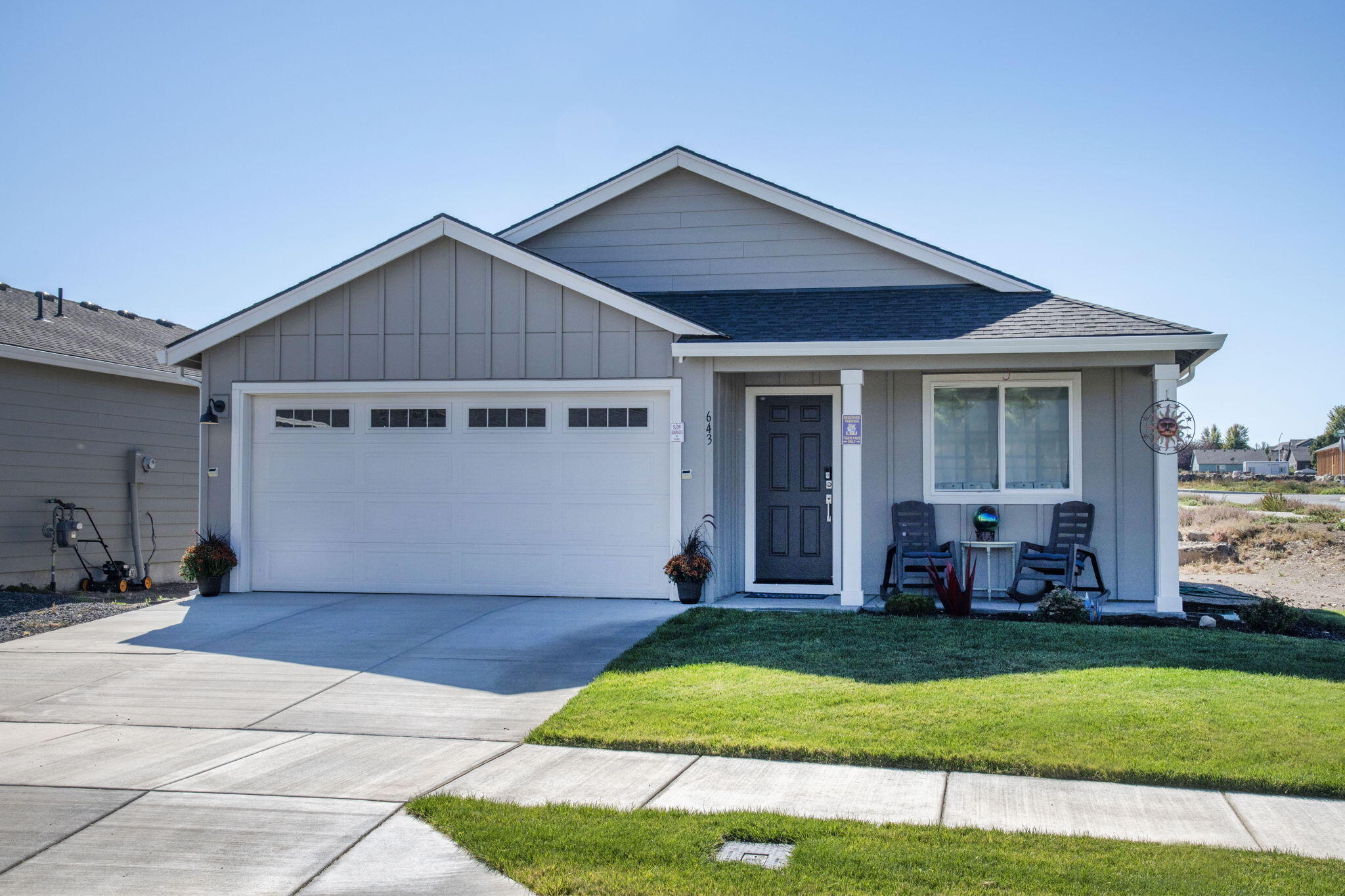 This light-and-bright home sits on a corner lot, creating a greater sense of privacy in an already peaceful neighborhood. Sagebrook Estates hosts proximity to downtown Madras with excellent local dining and shopping options, nearby hiking at the ''M'' hill trail, and is less than 1 mile to St. Charles Medical Center. The primary suite includes a generous walk-in closet. This home is virtually brand new, and the sellers have added high quality LVP flooring throughout the home. All GE stainless steel appliances are included in the sale. With a tankless water heater, as well as central heating and air conditioning, you will live in comfort year-round This home is Energy Star Certified to ensure maximized efficiency on utilities. Enjoy your evening glass of wine or morning coffee by the firepit on the new paver patio!