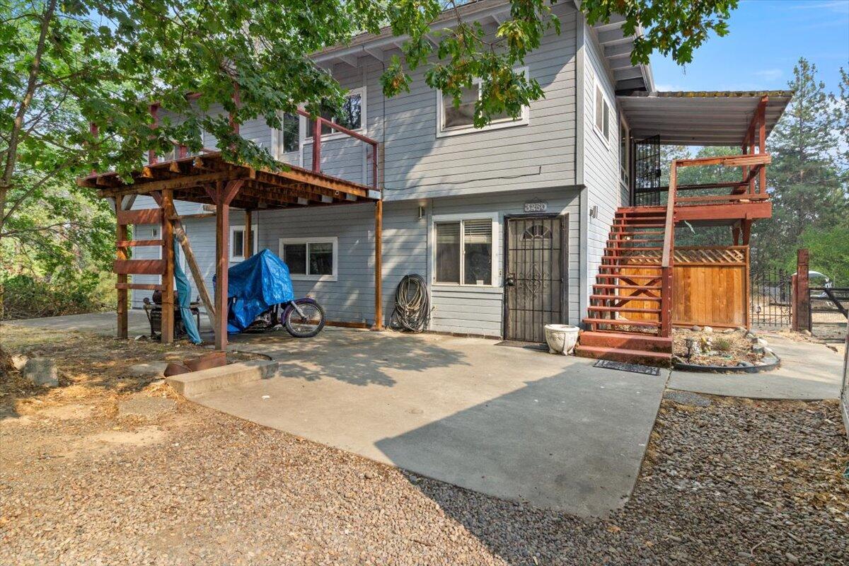 Come experience this peaceful 2.26-acre setting, nestled among the trees in North Grants Pass. This home is 2150+ sq./ft and set far back from the road with plenty of privacy. Convenient circular drive in place and there are multiple flat pads around the home for everyday recreation or entertaining guests. Although this home is priced as a 2-bedroom, it functions comfortably as a 4-bedroom home and offers an exceptional value in today's market. With dedicated exterior access to the top level, this home could also serve as an extended-family or two-family set up. Property also includes multiple decks and an outbuilding currently used as an art studio. Appointment Only. Please call your broker to arrange your private showing today!