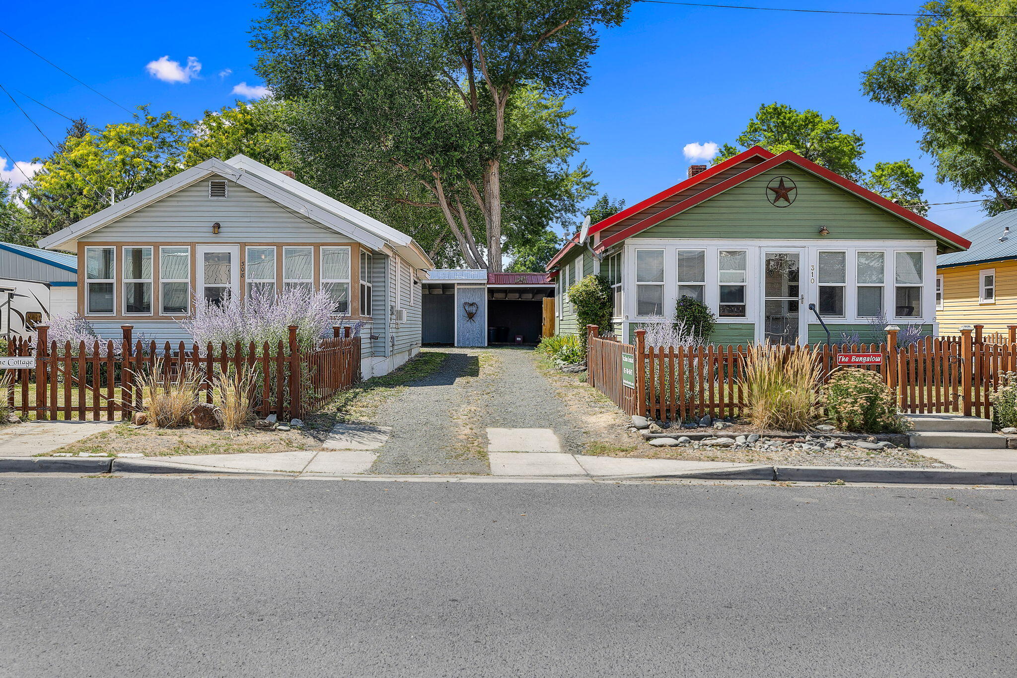 Great Investment Opportunity: Two Bungalow Homes for the Price of One! Unlock the potential of this unique property featuring two separate bungalow homes on their own lot—perfect for investors, multi-generational living, or anyone seeking extra income! Bungalow #1: Charming 640 SqFt living space, 200 SqFt of basement storage, Open kitchen with eating area, Laundry room, 1 bedroom, 1 bath, Cozy, enclosed front porch, ideal for morning coffee or evening relaxation, Outdoors is a fire pit area for those fun gatherings. Bungalow #2:, Spacious 704 SqFt layout, cozy light and bright front porch, 2 bedrooms, 1 bathroom , Large kitchen with breakfast area, Laundry room, 200 SqFt basement for extra storage, Private, fenced patio—perfect for entertaining or unwinding. Additional Highlights:, Carport with bonus guest bedroom—great for visitors or flexible use, Proven Airbnb income potential, Versatile living or rental options.