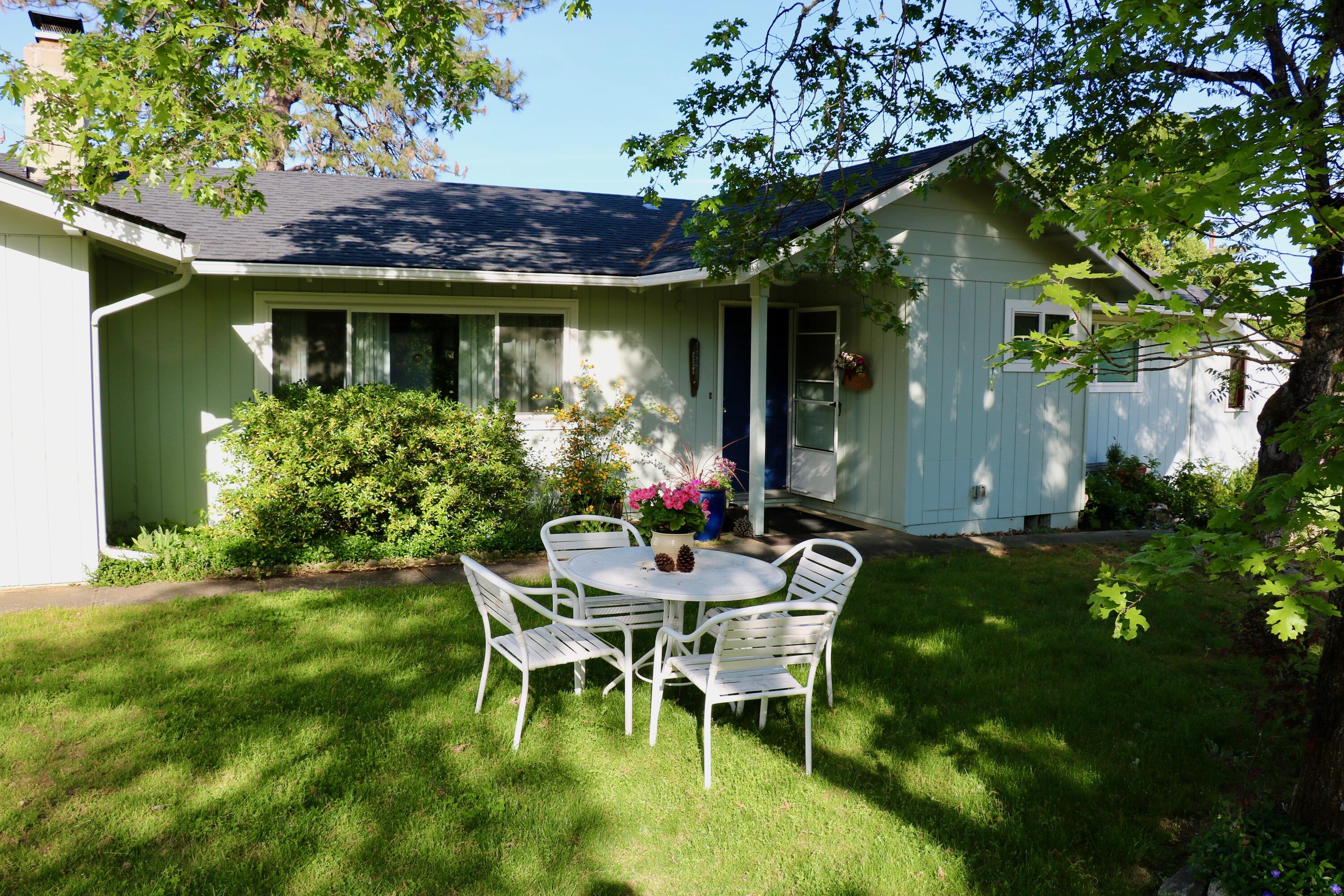 Country retreat only twelve minutes from historic Jacksonville! This thoughtfully updated home sits up & away from the road on nearly 3 lovely acres. There is plenty of room for gardening, enjoying a small hobby farm, potentially adding a workshop or all of the above! Beautiful new deck where you can catch a glimpse of Mt. McLaughlin and watch the wildlife. Recent improvements include New Roof 2024, updated bathrooms, new flooring in most of living area & bedrooms, new blinds, new dishwasher, new hot water heater, fresh paint inside & out and a new pump installed on a second well! Front room has a fireplace perfect for relaxing. Light & bright kitchen opens to family room w/ wood floors, a pellet stove plus a wall of windows through which natural light abounds. Don't miss the walk in pantry for extra storage. Three quiet bedrooms have updated windows, the primary bedroom has en suite bathroom & access to a sunroom perfect for an artist space or indoor plants.