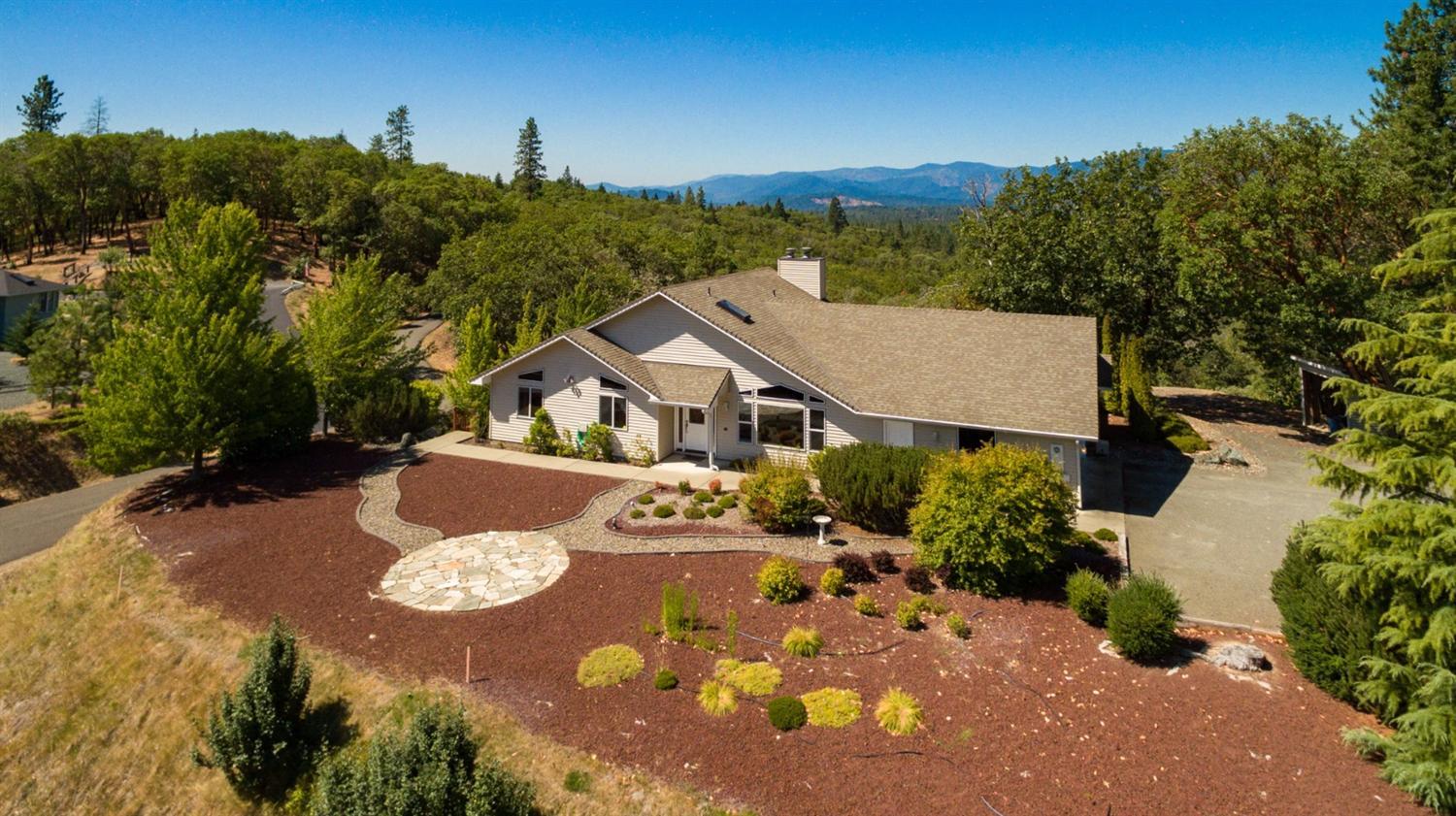 Amazing view home...! Enjoy your 5 Southern Oregon acres with beautiful mountain, valley & meadow views from your large back deck, lower concrete patio, or front yard. That's right...there is almost a 270 degree view with this North Valley Estate home. Great family home floor plan, perfect for entertaining. This 3118sf, (Assessor), home features 3 bedrooms, 2.5 baths, & large 2 car garage with a detached workshop or craft area. Other features include vaulted ceilings, spacious kitchen with center island, open living area, large bedrooms, ceramic tile floors in the entry, & a finished daylight basement with a media room and family room, complete with pool table. All information deemed reliable. Anyone interested in the purchase of this property should perform their own investigation into use and condition. See virtual tour.