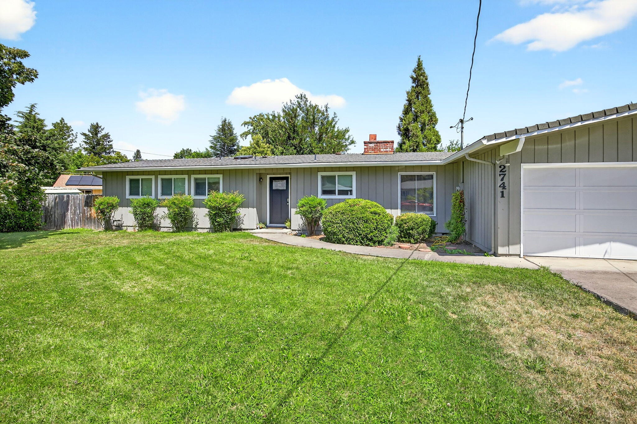 Nicely maintained single level 3 bedroom, 2.0 bath home located in a quiet neighborhood in S. Medford. This home has lots of updates which include: newer roof, newer vinyl windows, beautiful re-finished hardwood floors thru-out, 10' vaulted T&G ceilings thru-out, new vinyl plank floors in the bathrooms, Living room fireplace, Butcher Block counters in the kitchen, updated plumbing fixtures, bathroom sky-lite and much more. Partially finished 2-car attached garage. Covered and open rear deck areas. This home is situated on a level 0.28-acre site with gated RV parking, perimeter fencing and a huge rear yard with lots of privacy and room for a pool, garden area and etc. This gem of a home is move in ready. Call Listing Agent to schedule all showings.
