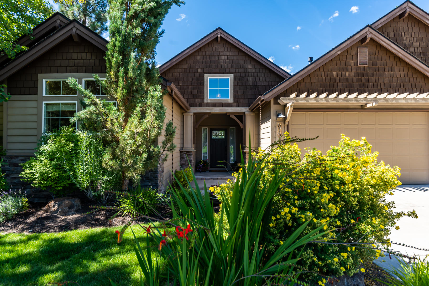 This beautiful single level home sits on over 1/4 acre lot on the canyon in the highly sought after River Canyon Estates.  The home is situated across the street from an open space and backs to the Deschutes River canyon.  You can enjoy the sounds of the river and the views of the mountains from the large paver patio with an outdoor fireplace and built-in BBQ.  When you enter the home you see straight out to the trees and mountains.  The vaults make the home feel even larger than its 3188 SF. 3 bedrooms, 2 1/2 bathrooms, a den and a bonus room provides room for all whether entertaining or working. The original owners remodeled almost everything in the home and added lots of nice touches.  This is unlike any other home in this neighborhood.  It is truly one of a kind.  Don't miss your chance to have the convenience of a community, but the private feeling of this amazing backyard.