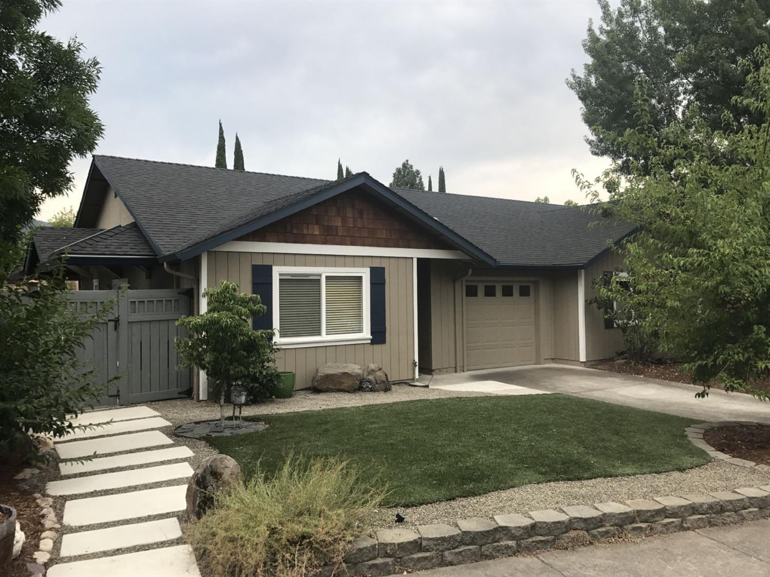 Charming, move-in ready, conveniently located home that's close to SOU, Ashland High, Junior High, and other schools. Just a few blocks from all the downtown activities, including: the library, Lithia Park, Shakespeare and Cabaret Theaters, as well as many fine restaurants and shops.Added features included: - Recently painted interior and exterior (2017) - Non-smoking property - Newly installed roofing (2015) - Fully landscaped front and back yards - New fencing on both sides of the property (2016) - 2 Outdoor storage sheds - Indoor attic storage - Covered lanai for year-around entertaining - Open concept layout - Finished garage which can be used as a third bedroom or office - 2+ bedrooms with 1 full bathroom (ample room to add a second one, if desired - Crown moulding throughout home - High efficiency HVAC heating and cooling system. Property is ADU/ or guest house compliant if buyer wants to build. Home is on a zero lot line on one side and shares a wall with neighbor.
