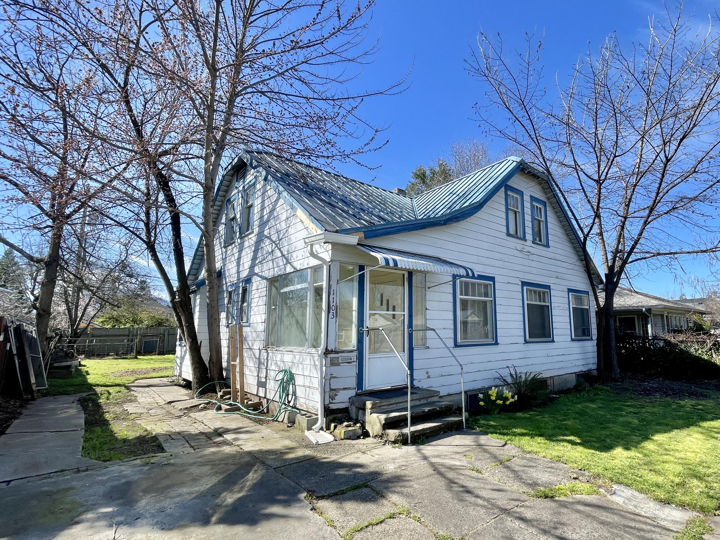Owner may carry- inquire for more info!--So much potential here! This 4 bed 1 bath home is ready for someone with the skills to restore it to its former glory.it features 2 bedrooms per floor, and a partial basement below. Take note of the metal roof, gas central heating, red oak and fir floors, fenced back yard, old fashion sleeping porch, and room to park a vehicle off-street. Call for more info!