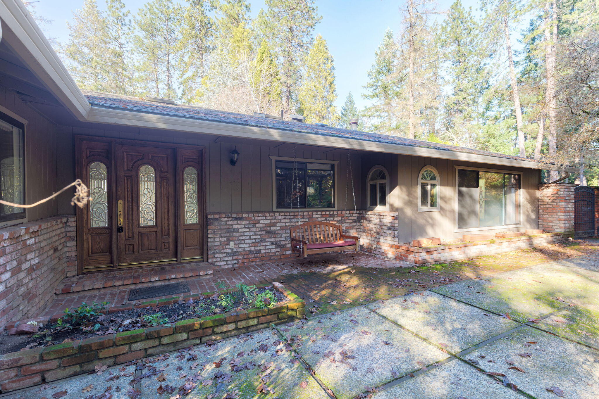 Discover the potential of this well-designed custom home — a private garden oasis on a peaceful, quiet street just moments from downtown Grants Pass. Enjoy lush, irrigated grounds with Grants Pass irrigation to keep everything green. The home features a comfortable floor plan with 3 bedrooms, 2.5 baths, an office, and two living rooms, plus a large kitchen ready for your personal touch. Additional highlights include a detached 2-car garage with studio room, expansive deck, and paved turnabout for extra parking. Sold below appraised value, this property offers an incredible opportunity to bring it back to its former glory. Home inspection on file.