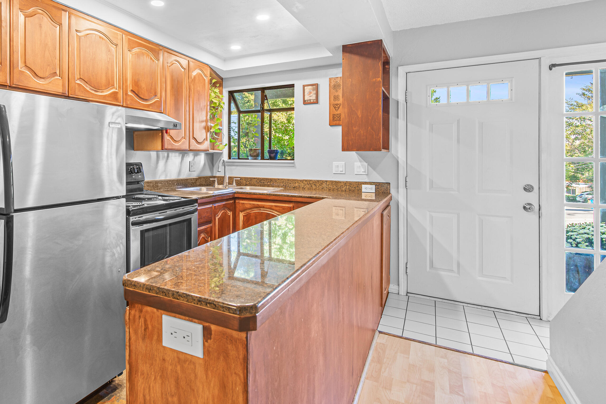 Low-maintenance condominium across from Asante Ashland Community Hospital, less than three minutes from dog-friendly Scenic Park, Ashland's downtown plaza, and Lithia Park! Main level with laminate floors, updated kitchen with granite counters and stainless appliances, refinished wood-fronted cabinets, garden window, half-bath, dining area, and living room with sliding glass door to concrete patio with space for barbecue and outdoor dining. Upper-level full bathroom with double vanity and tub shower, two bedrooms with closets, and private balcony with view of Grizzly Peak. Tudor Heights association dues of $350 per month cover all landscaping and exterior maintenance including roof, outdoor lighting, water, sewer, garbage, and recycling. Inquire for details!