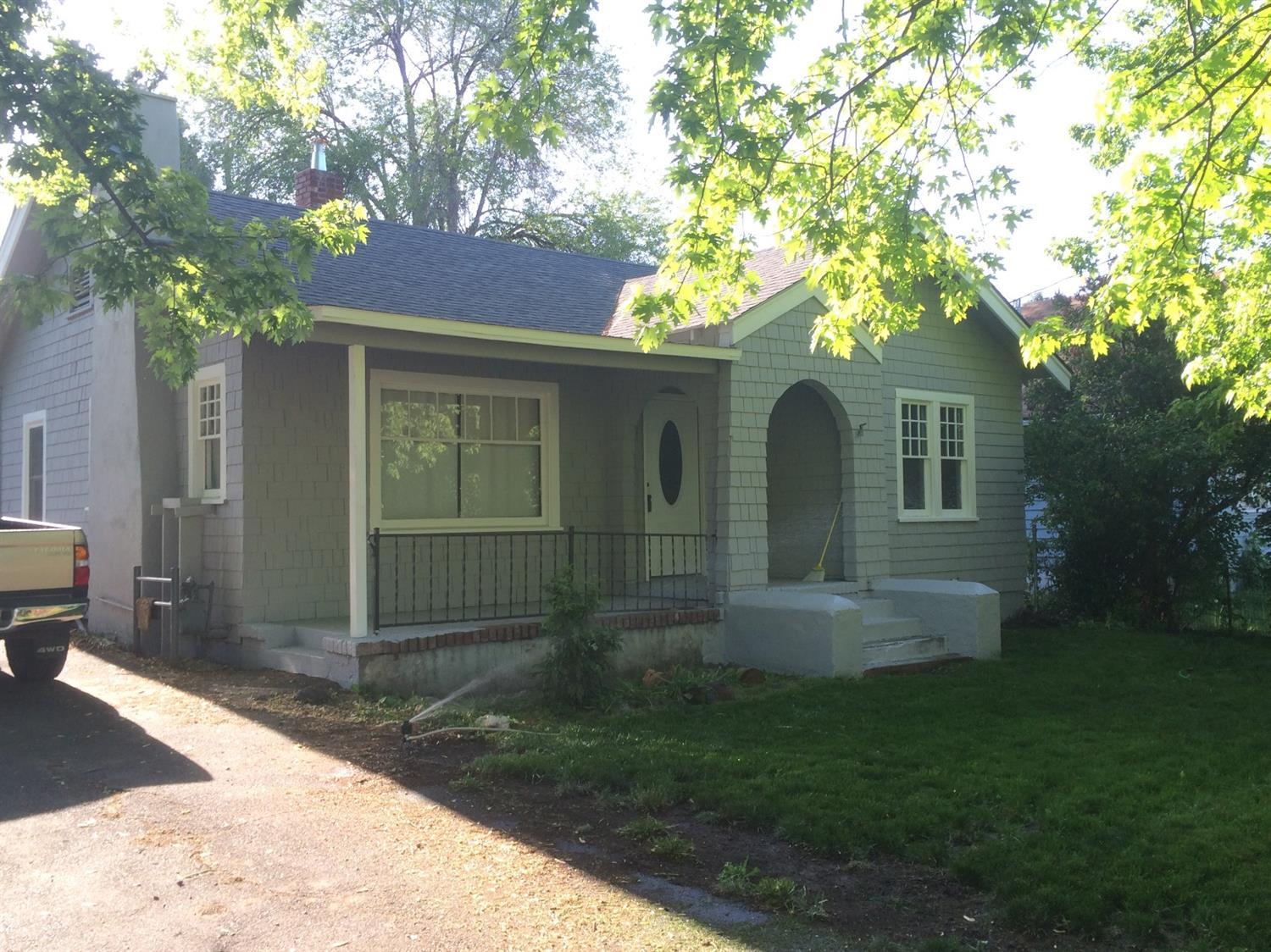 Cute 2 bedroom home on over 1/4 acre! Convenient location, this 2 bedroom home features hardwood floors, updated kitchen with newer cabinets and tile floors. Detached 24 X 24 car garage with a paved driveway, nice sized fruit & shade trees.