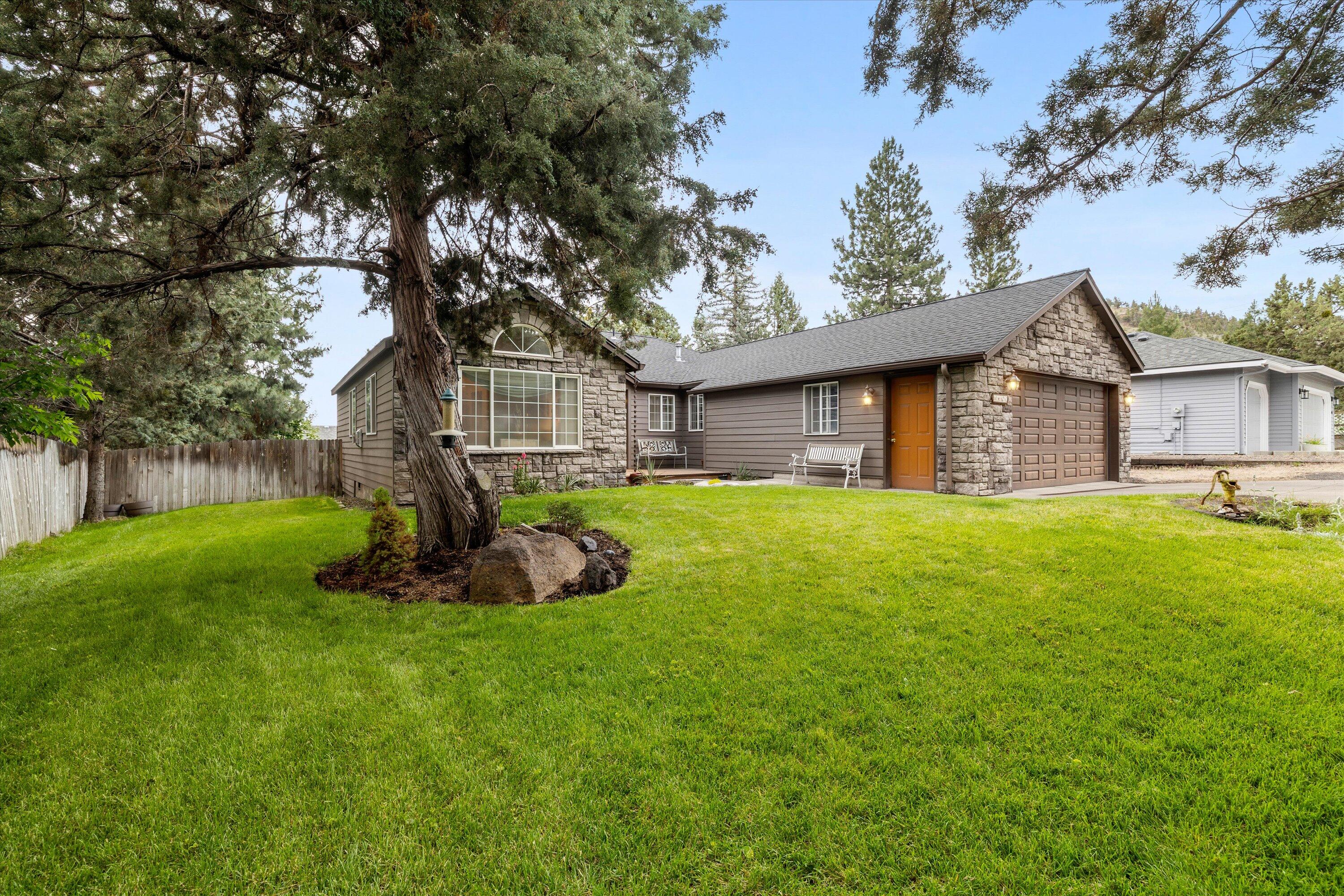 Beautifully maintained single-level home near Pilot Butte on a spacious 1/4-acre lot. This 3-bed, 2-bath home offers 2,042 sq ft of thoughtfully updated living space by the original owners. Features include wood and tile flooring, granite countertops, stainless steel appliances, and a stunning stone-faced fireplace. Enjoy multiple living areas including a family room, living room, separate office, and an enclosed sunroom that opens to a covered back porch. The roof was upgraded in 2017 with a 50-year composition shingle. Mature landscaping surrounds both the lush front yard and the serene backyard, offering privacy and space to relax. A 2-car garage completes the package.