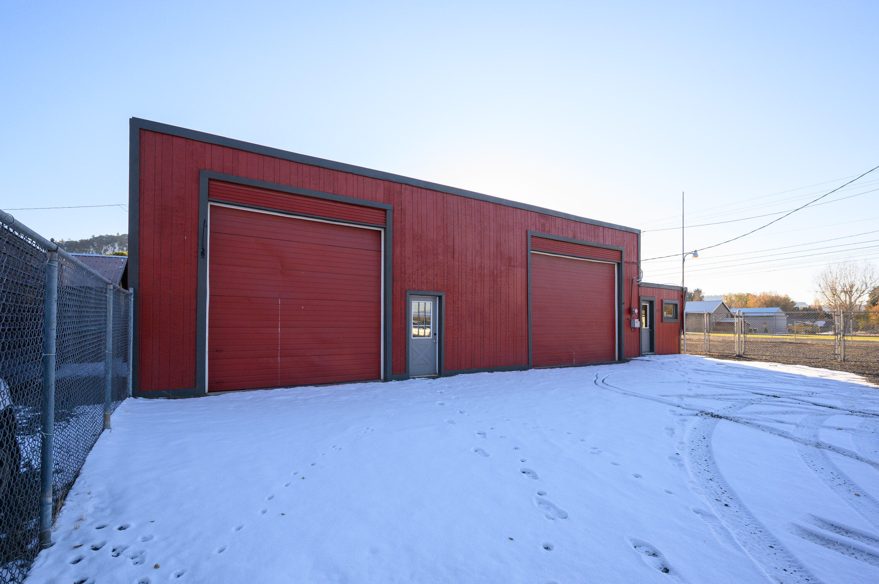 Great opportunity for owner-user or investor with a tenant. Property has good visibility and easy access from SE Combs Flat Rd. 
Perfect for auto repair, contractor headquarters, or other service and industrial uses or 
redevelop for retail. The auto paint spray booth can be included. 200 amp 3-phase power.

Building features a front office, two bays with overhead doors, storage rooms, a restroom, and a large fenced yard. Flexible zoning allows for many possibilities.