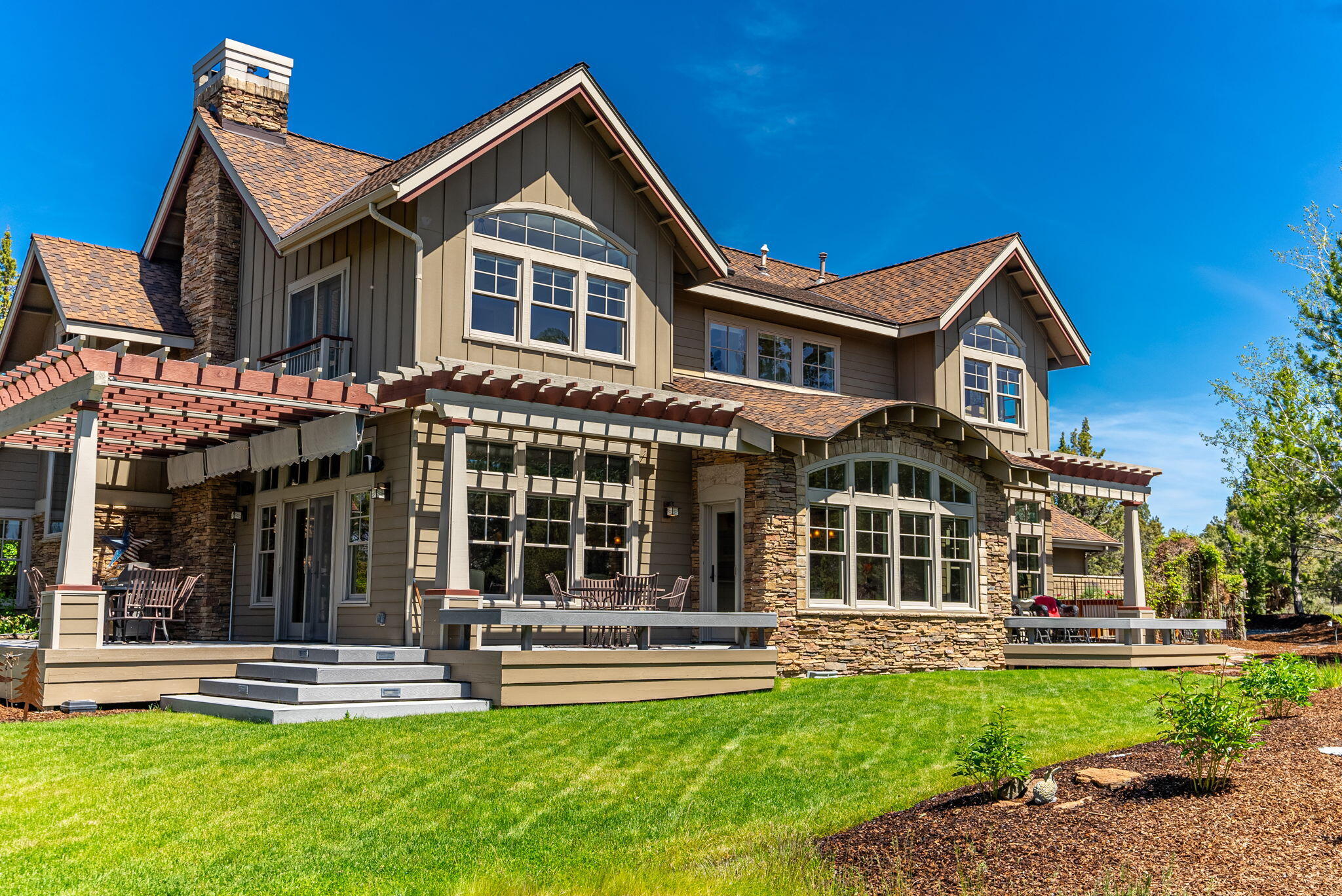 Immaculate high-end custom home built by renowned R&H Construction, proudly featured in Builder/Architect Mag, Central Oregon edition. This stunning residence is a showcase of sophistication, craftsmanship and design, highlighted by rich Brazilian cherry wood floors and an abundance of natural light throughout. Blending timeless elegance with distinctive style, the home features a hammered copper bar top, limestone slab countertops, creating a unique contrast that exudes sophistication. Every corner of this property is filled with character. Enjoy a spa-like experience with a steam shower and retreat-worthy primary suite with Mountain Views. An oversized garage offers ample space for vehicles, gear, golf cart, etc. Step outside to a beautifully landscaped yard complete with a tranquil water feature, this outdoor space is prefect for relaxation or entertaining.  Nestled in a private, golf course community offering exclusive amenities including a pool, clubhouse, and pickleball courts.