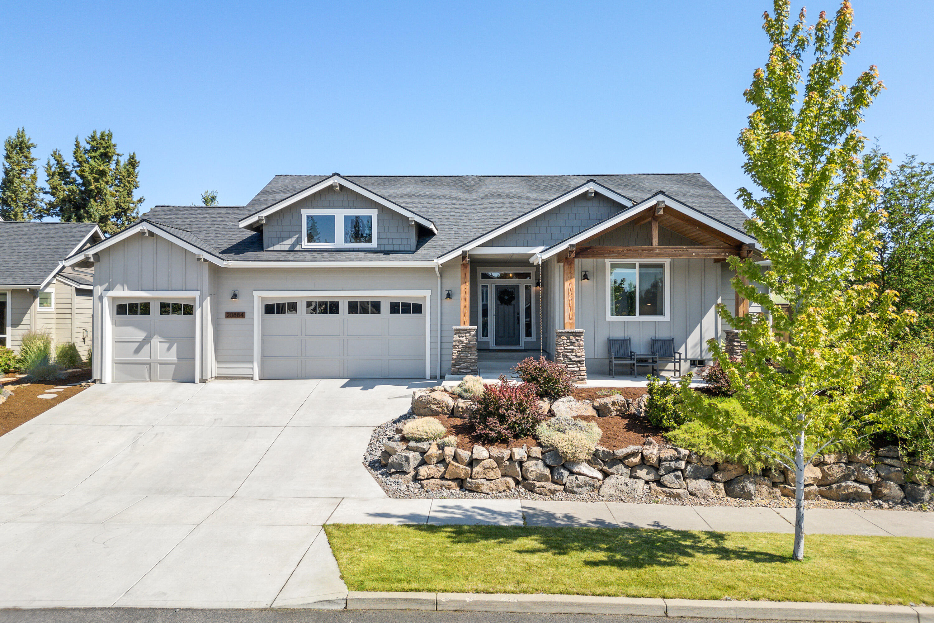 Beautiful single-level home with four spacious bedrooms. Two of these bedrooms have walk in closets. This home has a very open floor plan.The kitchen offers solid surface countertops, a gas cooktop, pantry, and island—ideal for cooking and entertaining. The open living area features a cozy gas fireplace with wood-framed windows. Tile flooring throughout the baths, utility room and walk-in shower. Outside, enjoy the covered back patio in a serene backyard retreat complete with a tranquil water feature and hot tub—perfect for unwinding or hosting guests. Fully landscaped front and backyards with sprinklers. Oversized finished 3-car garage with high ceilings. Just a short walk to Rock Ridge Park!