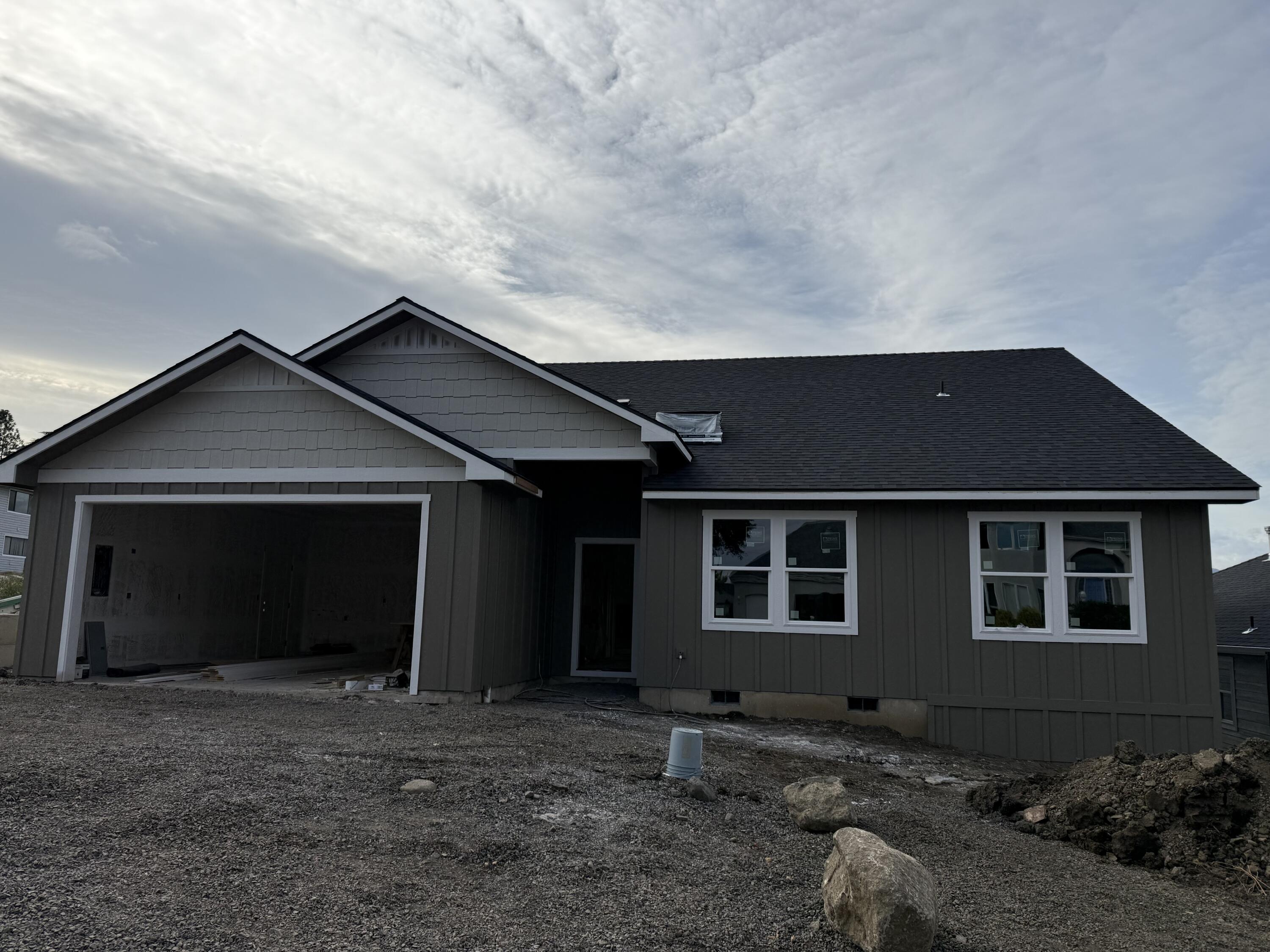 Welcome to this newly constructed home in East Medford. This residence features a split-bedroom floor plan with four bedrooms and two bathrooms. The open-concept design includes a vaulted living area that flows into a modern kitchen, complete with stainless steel appliances and a large pantry. The primary suite includes a private bathroom and walk-in closet.  Outside, the landscaped yard features automatic sprinklers, and the covered back porch offers space for outdoor enjoyment. The home is located near shopping, dining, and schools. Estimated completion 11/15/2025.

Disclosure: Listing agent holds an ownership interest in the property. The builder is VA approved.