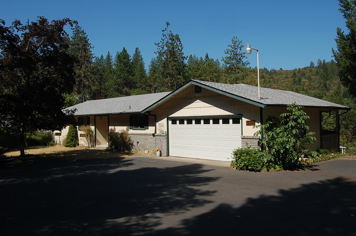 MULTIPLE OFFERS IN -The home is 1141sf with 3 bedrooms, 2 baths, open concept living room/kitchen/dining room, located on 1.25 Acres. View the surrounding mountain range from the large covered back porch. The home sits towards the front of the property giving you nearly an acre of backyard, lots of room for animals, garden area, etc. There is a tool shed, greenhouse, storage, and storage under the back of the home.  The property is fenced and gated. ''SOLD AS IS''.  This is an estate sale and is being 'SOLD AS IS''