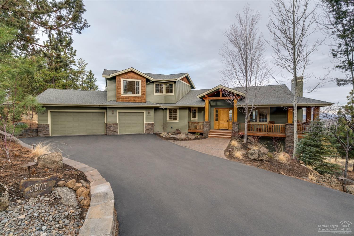 Awbrey Butte retreat on 1.45 acres w/ amazing views from every angle! Extended 3-car garage for your toys. High-end finishes & fixtures around every corner: floor-to-ceiling windows, vaulted wood ceiling, chef's kitchen. Open concept floor plan is an entertainer's dream! Fabulous master suite & don't miss the home theater room. Explore the array of outdoor living areas: view deck, patios, hot tub, fire pit, ultimate privacy & much more! Truly a must-see!