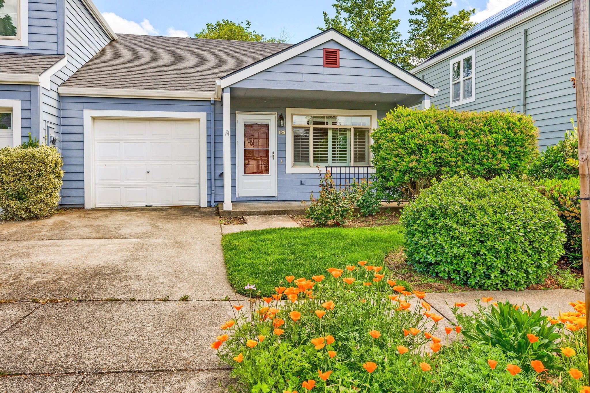 Charming single-story townhome with an open floor plan, vaulted ceilings, and oak hardwood floors throughout. The bright dining area features a bay window, and the kitchen opens to a covered deck—perfect for BBQs with bar table & stools. The primary bedroom includes a private deck surrounded by trees and lush vegetation with mountain views. A brand new Heat Pump HVAC is just installed. Enjoy the convenience of an attached garage with built-in shelving, washer, and dryer. The well-managed HOA ($173/month) covers front yard maintenance and beautifully maintained common areas, including open green spaces, nicely designed quiet walking paths with peaceful mountain views, wetland and guest parking. Ideal for first-time buyers, down-sizers, or investors. Located conveniently in a neighborhood near shopping, the YMCA, and a planned 6 acre city park with direct access. Quick access to I-5 makes commuting easy. Move in ready!