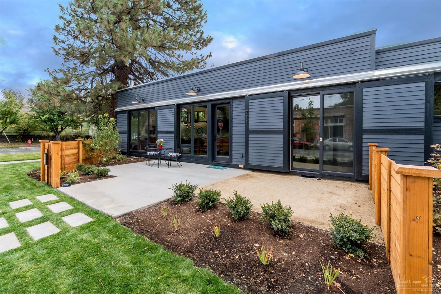 Remarkable single level mid-century modern cottage. Brand new home in the historic district, ideal location mid-way between downtown & the Old Mill District. Light & bright with huge windows & skylights. Open floor plan with high ceiling great room concept, island kitchen w/quartz counters, stylish laminate cabinets & stainless appliances, retro gas fireplace, large bedrooms & multiple private outdoor spaces. Super energy efficient, fully landscaped & fenced. Large utility room for storage & carport.