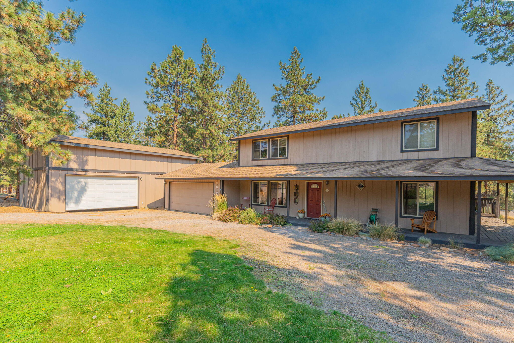 Experience Central Oregon living with this exceptional residence nestled within the esteemed Whychus Canyon Estates community. Nearly one acre of landscaped grounds. Step inside to a thoughtful layout of 3 bedrooms, 2.5 bathrooms, and a versatile bonus room adaptable as an office or additional guest space. The main floor showcases a well-appointed kitchen with granite countertops and tile floors, the dining area exits to the wrap-around deck, perfect for outdoor gatherings and relaxation. First floor has a cozy den or family room, a convenient half bath, and a laundry room. Embrace the outdoors within the fenced rear yard, for pets or 4H animals, and enjoy activities on the concrete sports court with a basketball hoop. Pull-through gravel driveway provides parking, complemented by a two-car attached garage and a sizable 24'x38' shop. Lush landscaping and sprinkler systems ensure effortless maintenance, while ponderosa trees provide shade. Come live the Central Oregon lifestyle.