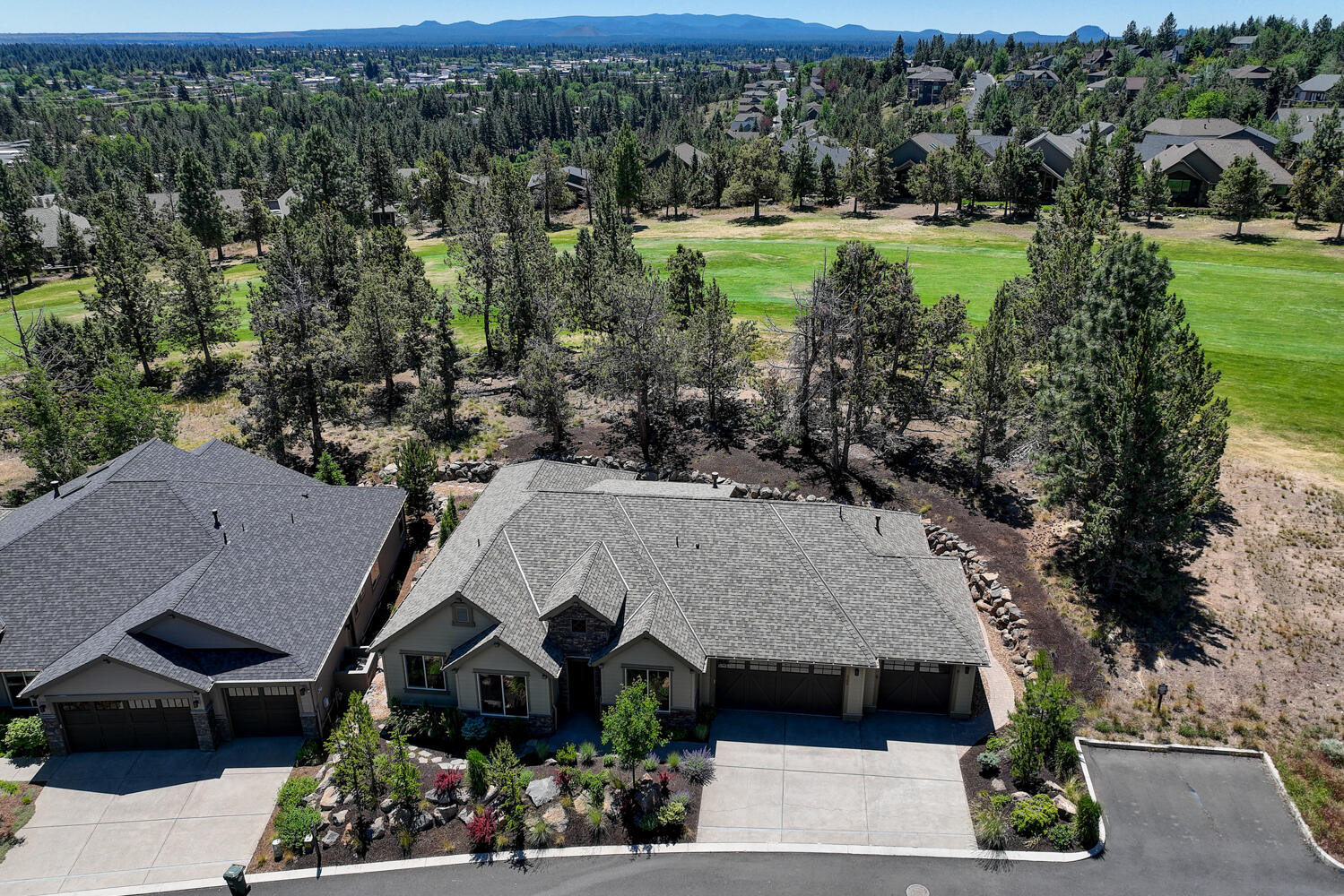 Gorgeous Single Level Home on the 18th Fairway of River's Edge Golf Course!  This 2016 Built, 2200sf, 4Bd/2.5Ba home features: stone fascia & exposed aggregate driveway, beautiful low maint Xeriscape Landscaping, Open floor plan Great Room w/tall coffered ceiling, tinted thermal windows, HW flooring, floor-to-ceiling stone Gas fireplace, wet-bar w/quartz counter & wine refrigerator, open dining/kitchen w/slab quartz counters, quartz island/B-Bar, SS appliances, big pantry w/barn door, spacious primary suite w/coffered ceiling, sitting area, remote window shades, huge walk-in closet w/built-ins, private bath w/heated tiled floor, his & her slab quartz vanities, large zero-clearance tiled shower w/pebble floor, private covered back patio w/fan & TV hookup & large uncovered paver patio area, Gas FA Heat HVAC system w/Air Cleaner & Humidifier + Central AC, Central VAC system, Hunter Douglas window coverings!