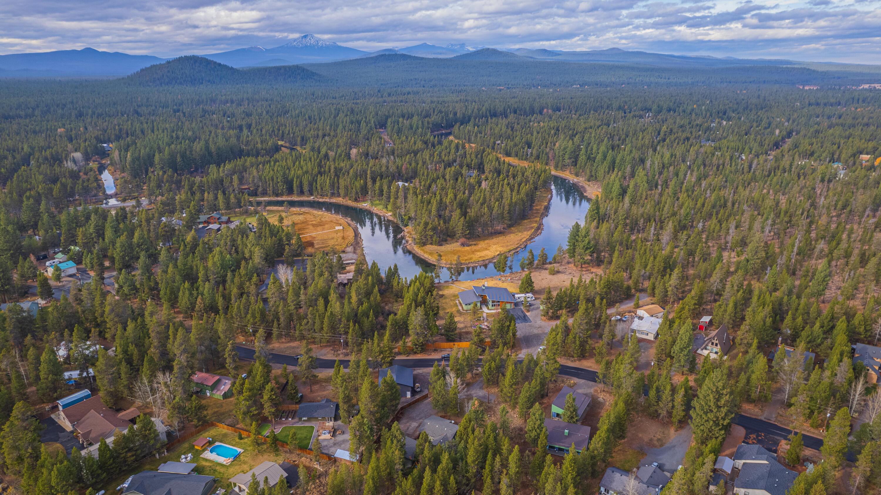 The perfect oasis in Oregon Water Wonderland! Great opportunity for a cute home home on a large lot. Located just a minute ort two from the Deschutes River, the homeowners marina/park and 40 acres of National Forest along the river, this home offers lifestyle flexibility in a package that is greater than the sum of its parts. Perfect for first time home buyers or those wanting to downsize or secure a great Sunriver area get away.

The subdivision has paved roads, water and sewer. The cute and clean main home has a nice open floorplan with the living, dining and kitchen areas flowing out to a nice deck, hot tub and fenced back yard with a firepit. The detached garage also has a unique flex room, in addition to the  parking bay, that isn't included in the square footage. This space is great for a home office, workout room, artist studio or hobby room. Because of the large lot, there is plenty of room to expand the home or build a great shop for all of your toys!