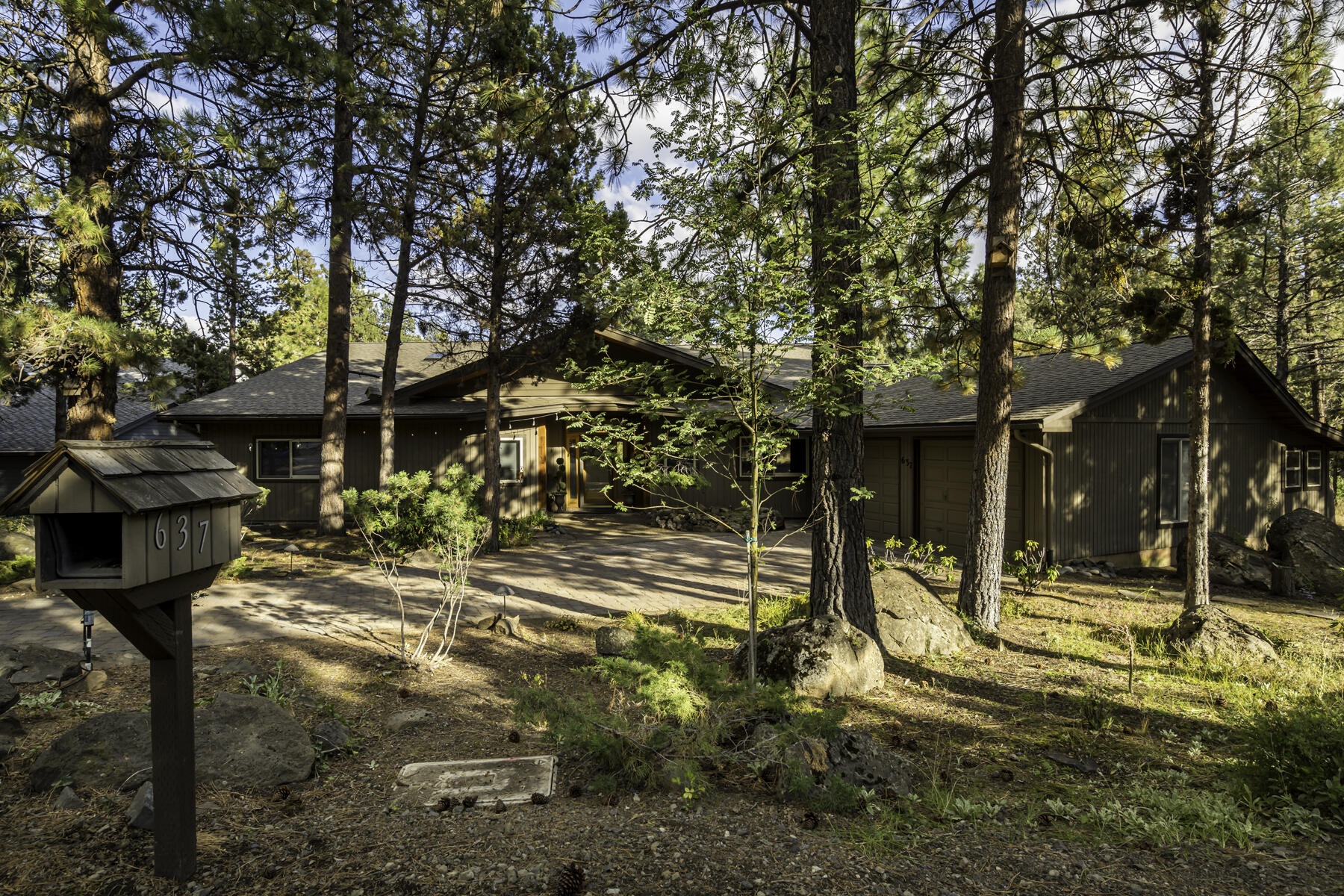 Location! Location! Location! This stunning property offers breathtaking views and tranquil surroundings on 100 feet of river frontage.  Great living area showcasing stunning vistas through large windows. The cozy fireplace adds warmth and ambiance to the space, making it the perfect spot to unwind on cool evenings. The fully equipped kitchen features modern appliances, ample counter space, and custom cherry cabinetry. The bedrooms are generously proportioned and comfortable, each offering its own unique view of the natural surroundings. Primary bedroom has an ensuite bathroom, and access to the deck. Outside, the backyard is a true oasis. You can revel in the tranquil sounds of the river while lounging on the expansive deck. The home also features a two-car garage. Located in a serene and peaceful neighborhood, close to hiking/biking trails, and adjacent to common area for added privacy, this property is the perfect retreat from the hustle and bustle of city living.