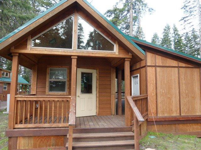 Own your own cabin at picturesque Hyatt Lake with easy access to the lake. Enjoy year round activities; fishing, boating, mountain trails, snowshoeing, cross country skiing, snowmobiling, etc. Owner has a 1/22 ownership in 30.18 acres of land. HOA dues are $285/month which includes TV, internet, and snow plowing. The cabin has 1 bedroom, 1 bath, kitchen and large loft area. The deck area contains a lockable, finished storage area. Association maybe providing an area for RV parking for guests
