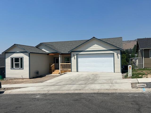 New construction located in a newer subdivision! Featuring an open floor plan with 3 bedrooms, 2 bathrooms, and 1668 sq.ft. Home features custom wood cabinets, stainless appliances, large laundry room with pantry, and some vaulted ceilings. Nice primary suite with big walk-in closet, soaking tub, and double sink vanity. Laminate floors throughout with gas forced air heat and AC. Great deck and  views of Hogs Back. Home will be fenced with no landscaping.