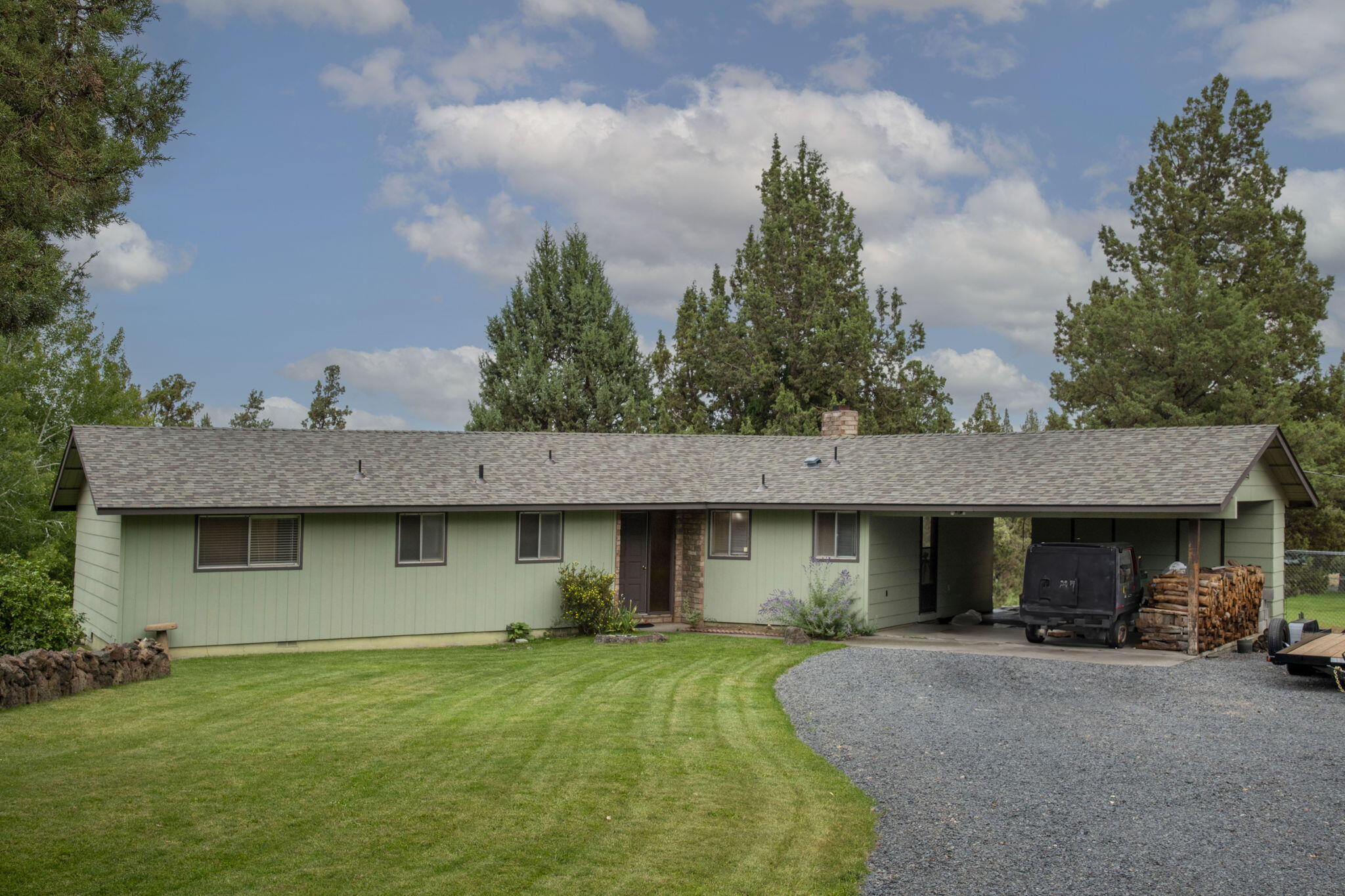 Rare opportunity—this is the first time this property has ever been available! Set on 2.53 irrigated acres with 1.73 acres of irrigation water rights, the property is ideal for horses, animals, small-scale farming, or simply enjoying all that Central Oregon has to offer. The 4-bedroom, 2-bathroom 1537 sqft single-level home includes a new roof, two driveways, and a spacious deck to take in Powell Butte and peek-a-boo views of the Cascade peaks. Enjoy the cozy living room with a fireplace, open beams and wood details on cool Autumn and Winter days. Cross fencing, double gates, Storage shed and a horse stall with expansion potential make this a versatile and valuable find! A horse owner's dream setup—dual street access with a gated pasture entry offering flexible movement and access. Don't miss this opportunity! Call your favorite agent today to schedule your private showing.