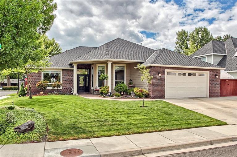 Enjoy the peaceful feeling of country living and the convenience of being close to town in this beautiful one level 3 bedroom, 2 bath home plus an office. It features hardwood oak flooring in the entry, kitchen & nook. 13' coffered & lighted ceilings, beautiful cabinets & wood accents throughout. Tile flooring in the baths & utility room. The master suite has a large walk-in closet, granite shower & jetted tub. Jenn-Air stainless appliances, leaded glass throughout, and a central vac system. 50 year comp roof, over sized 2 car garage, and a 12'W x 30'D gated, concrete, parking area on side of home for small RV, boat or trailer. Located on a nice corner lot with beautiful fountains in both front and back yards.