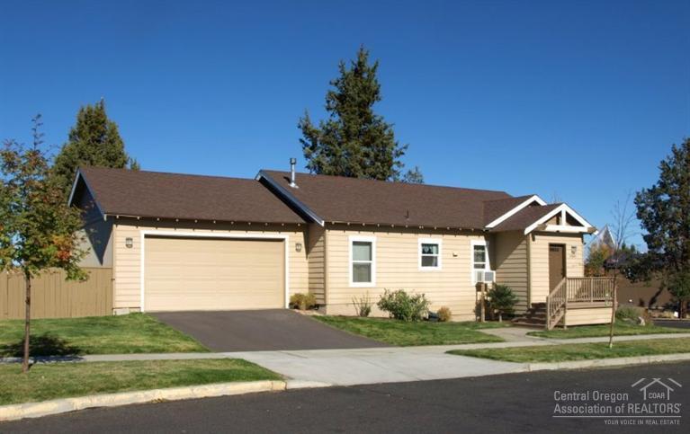 Very popular NE Bend neighborhood & a rare double corner lot. This home features an open floor plan with vaulted ceilings, gas fireplace, extra wide garage with built in storage & a fully fenced private .15 acre lot with 2 patios. The back & side yards are combined for an extra large outdoor area. The front door has a nice entryway with room for shoes & coats. White kitchen appliances, SS sink, vinyl & carpet flooring & Formica counters. Only 2 homes on this street. A must see!