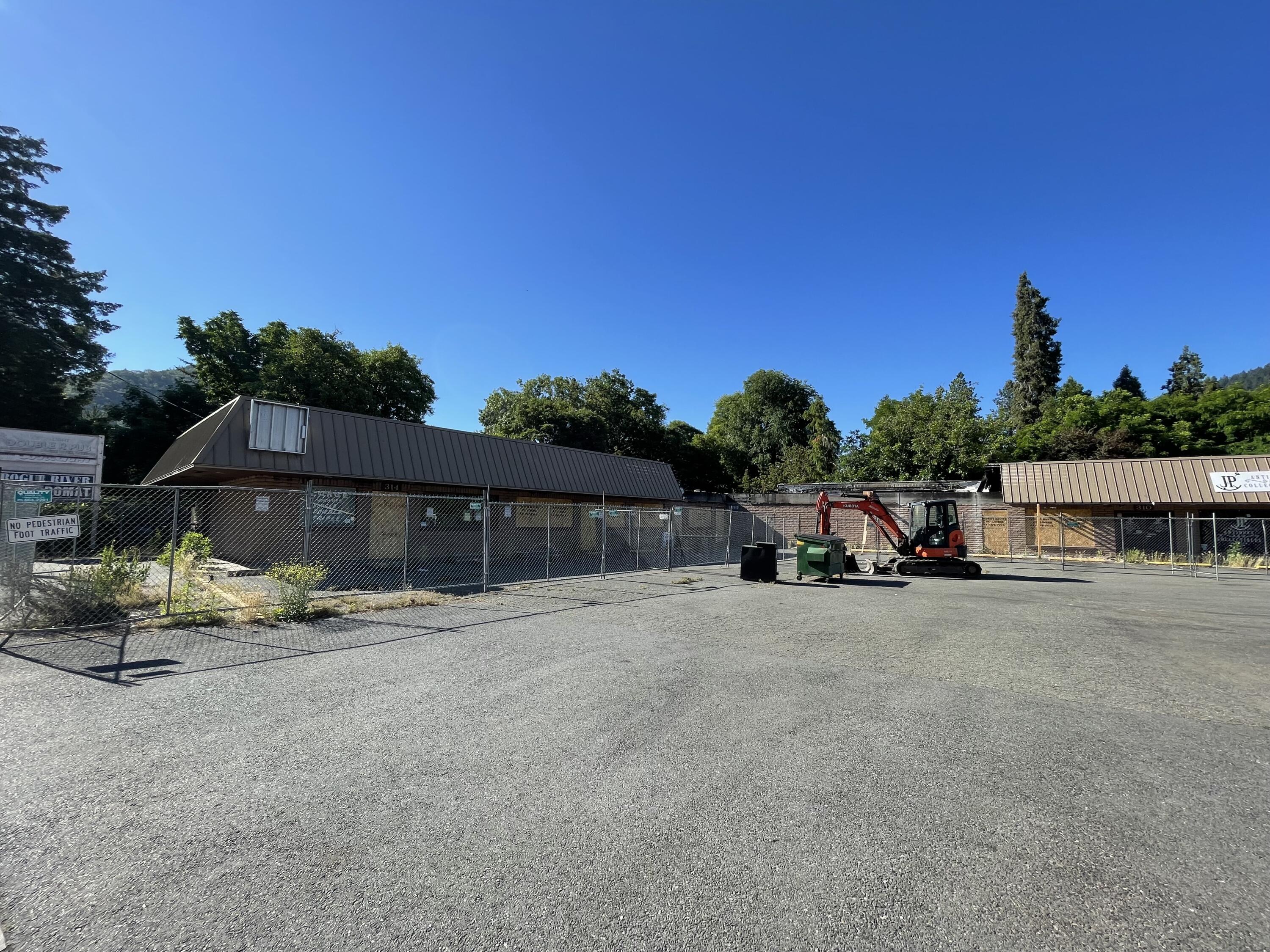 Great opportunity for a rebuild in downtown Rogue River. Main structure has major fire damage and potential rebuild requirements. Existing freestanding restaurant is active. Buyer to perform due diligence. Excellent corner location on Main Street.