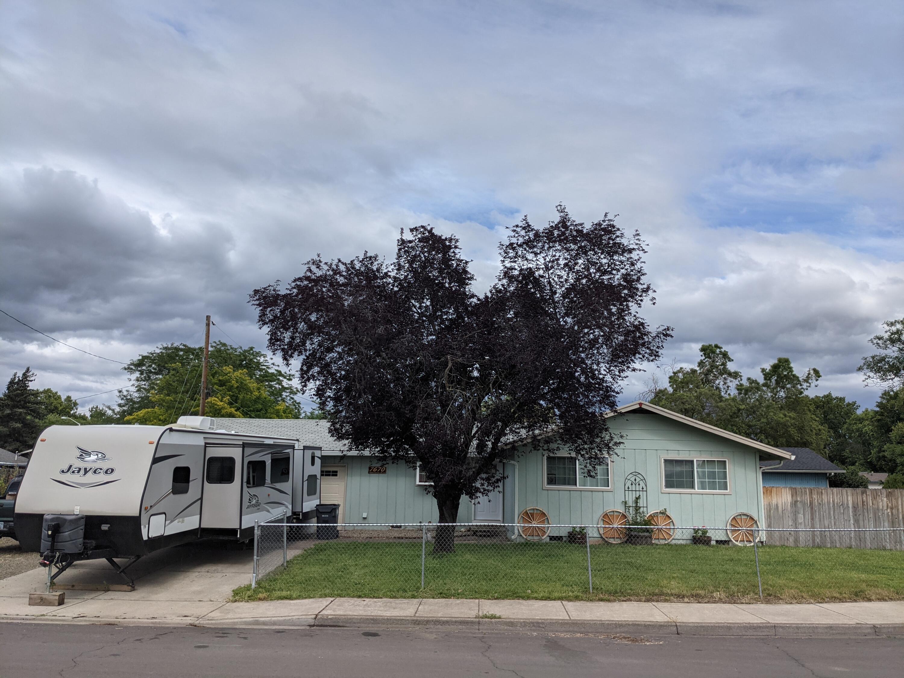 This 1100 sq. ft home features 3 bedrooms and 2 bathrooms.  The home has been remodeled inside with new doors throughout, new flooring, new air ducts, all new baseboard molding and new paint throughout.  The kitchen has plenty of cabinets and counter space as well as stainless steel appliances.  Large living room with natural light as well as a fireplace.  Three large bedrooms make up this home.  Outside you will find a large yard, room to grow a garden and extra long RV parking.