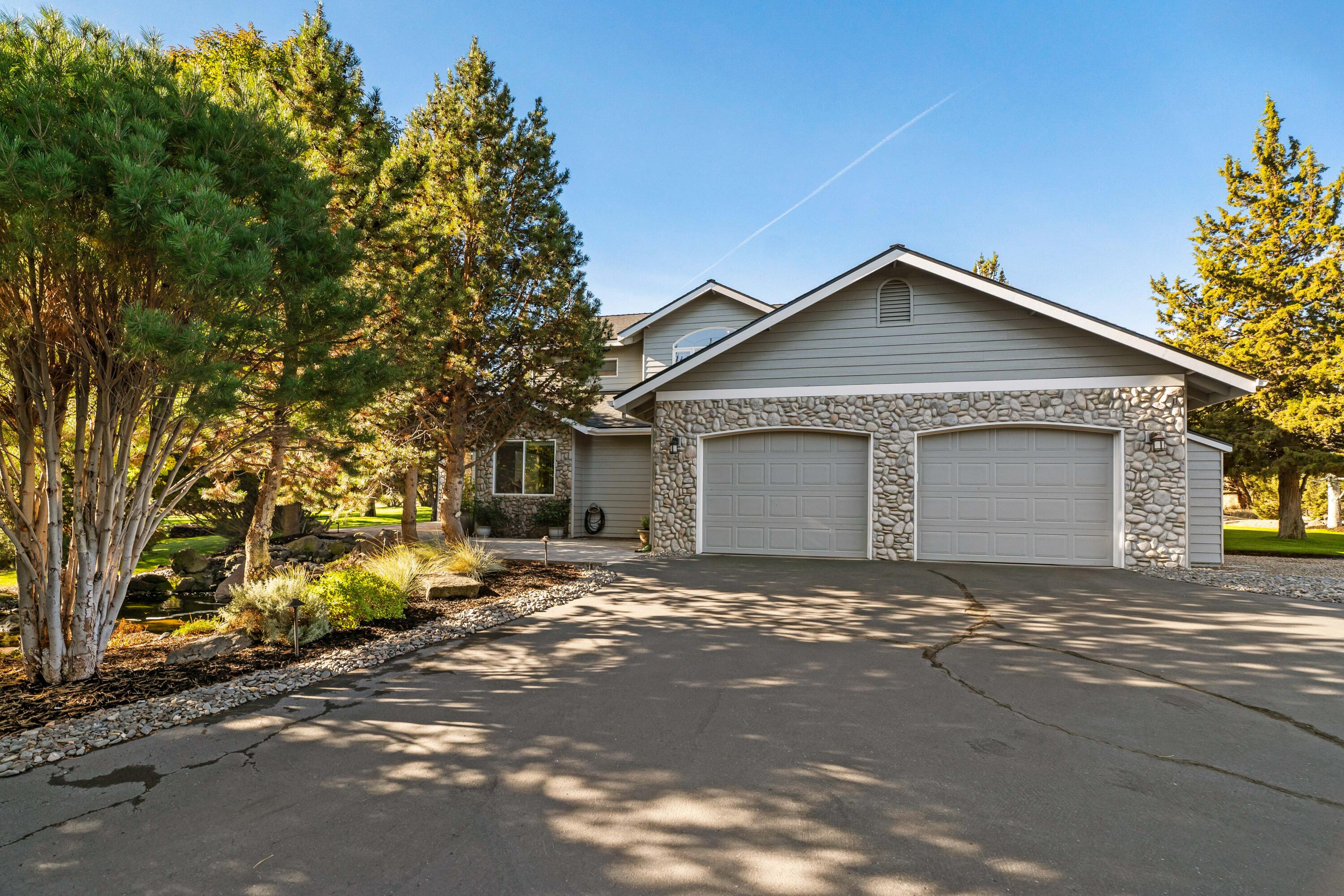 Located in the original gated community of Eagle Crest Resort, this beautiful home is perfectly situated on .63 park-like acres adjacent to common space creating a private retreat. 

This open-concept floor plan features a main level with a great room showcasing vaulted wood ceilings and a gas fireplace, two ensuite bedrooms, a large open kitchen with slab granite countertops, an expansive breakfast bar, two dining areas, a laundry room, and a half bath for guests. Upstairs you will find a loft, two additional bedrooms; one with a walk-in closet and built-in wet bar, a full bath, and a deck with a view of Mt Jefferson. 

The expansive front paver courtyard overlooks the pond while the back patio is an entertainer's dream with Bullfrog Spa, covered built-in BBQ island, and an electric awning. 

The oversized double-car garage plus the paved and unpaved parking pads provide ample room for your guests.

New roof and exterior paint in 2021. Enjoy all Eagle Crest amenities!