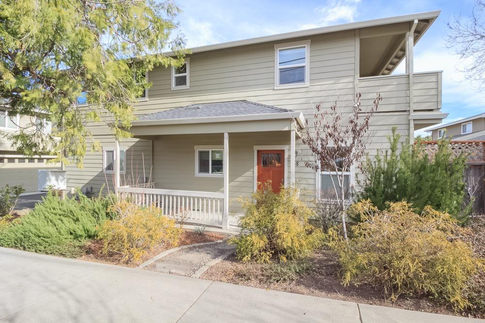 Prepare to be impressed with this lovely unit in desirable Ashland location, close to town, park and railroad district. Main level has open floor plan w/kitchen having beautiful wood cabinets, granite counters, built in appliances and island/breakfast bar w/3 bar stools which are perfect for gathering & entertaining while enjoying gas fireplace. Small easy maintenance fenced yard off living room. Bamboo flooring accents the main floor. This front unit is bright and offers plenty of natural light. All bedrooms are nice size with master having walk in closet, balcony with mountain views, tiled tub/shower combo and double sinks. Plenty of storage though out. There is a Sol-Reliant energy efficient solar assist water heater system along with the energy saving benefits of dual zone heating/cooling system. Washer, dryer and refrigerator are included in sale.