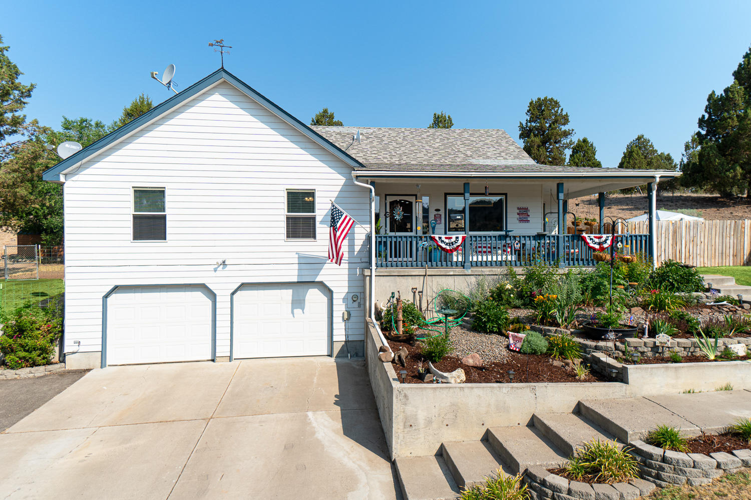 Newly updated farm house style home just minutes from Prineville Reservoir & town - complete w/huge valley views! Terraced front yard & covered front porch are a great spot for enjoying the sunrise or afternoon shade. Great room plan w/cozy fireplace, freshly refinished kitchen & open dining area. Main level offers a primary suite + 2 additional bedrooms & a full bath. Wainscoting touches add to the charm. Dining extends to a deck w/water feature & pasture beyond. Lower level features a spacious bonus room w/half bath & laundry. Adjoining garage is an oversized 2 car w/shop area & room for toys. Property is fully fenced & cross fenced, ready for your horses or livestock! New water purifier just installed to eliminate the local hard water found in Prineville wells. New paint, new windows, well maintained & ready to move into. Bring your toys & RV - there's a spot for it here.